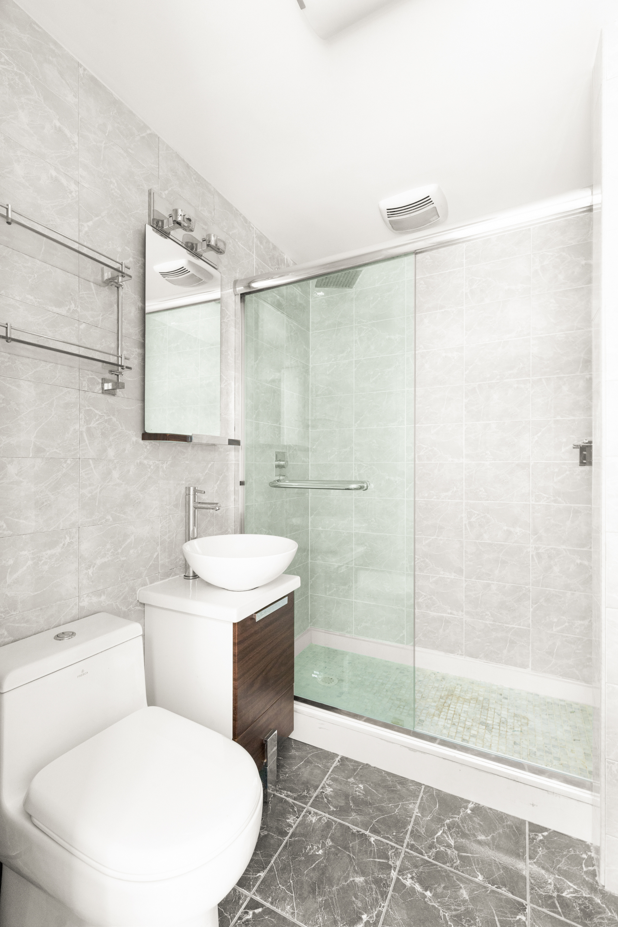 839 Carroll Street, Unit D1 Brooklyn, NY 11215 - Photo 5 of 7 a bathroom with a toilet sink and shower