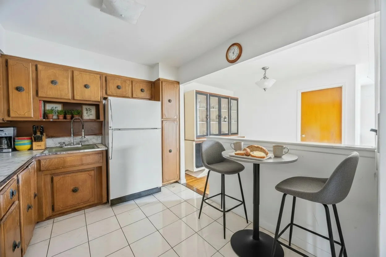 a kitchen with stainless steel appliances granite countertop a refrigerator and a stove top oven
