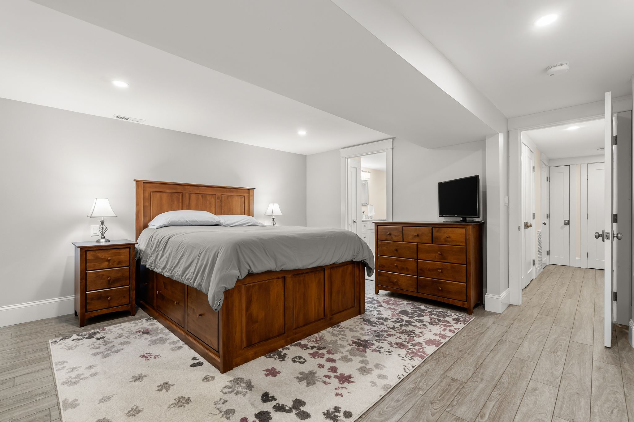 367 Silver Street South Boston, MA 02127 - Photo 4 of 9 a bedroom with a bed and wooden floor