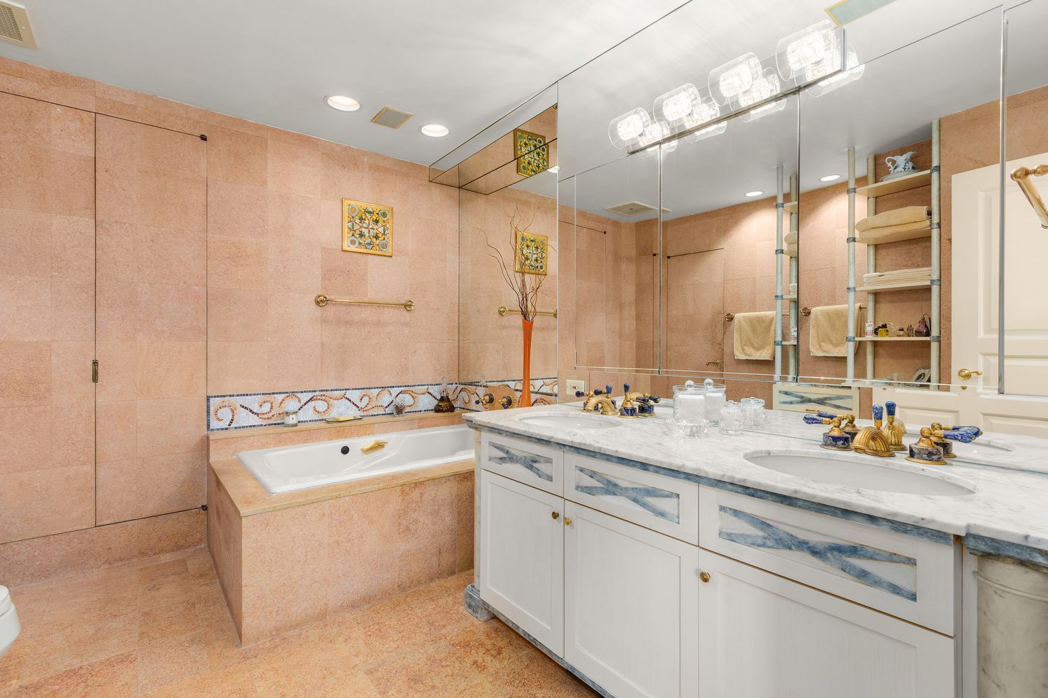 a bathroom with a granite countertop sink a toilet and shower