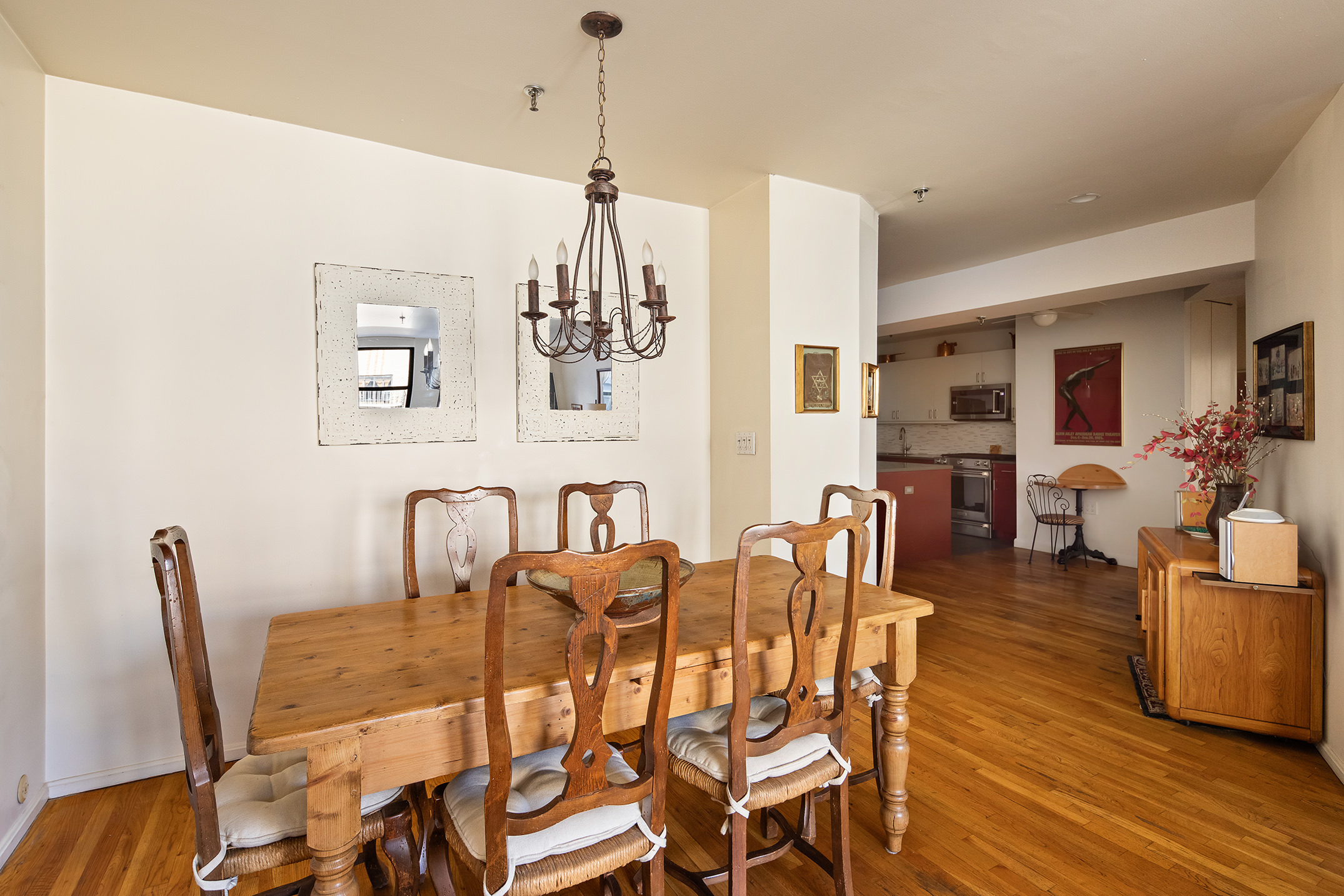 240 West 23rd Street, Unit 5A Manhattan, NY 10011 - Photo 2 of 7 a view of a dining room with furniture and wooden floor