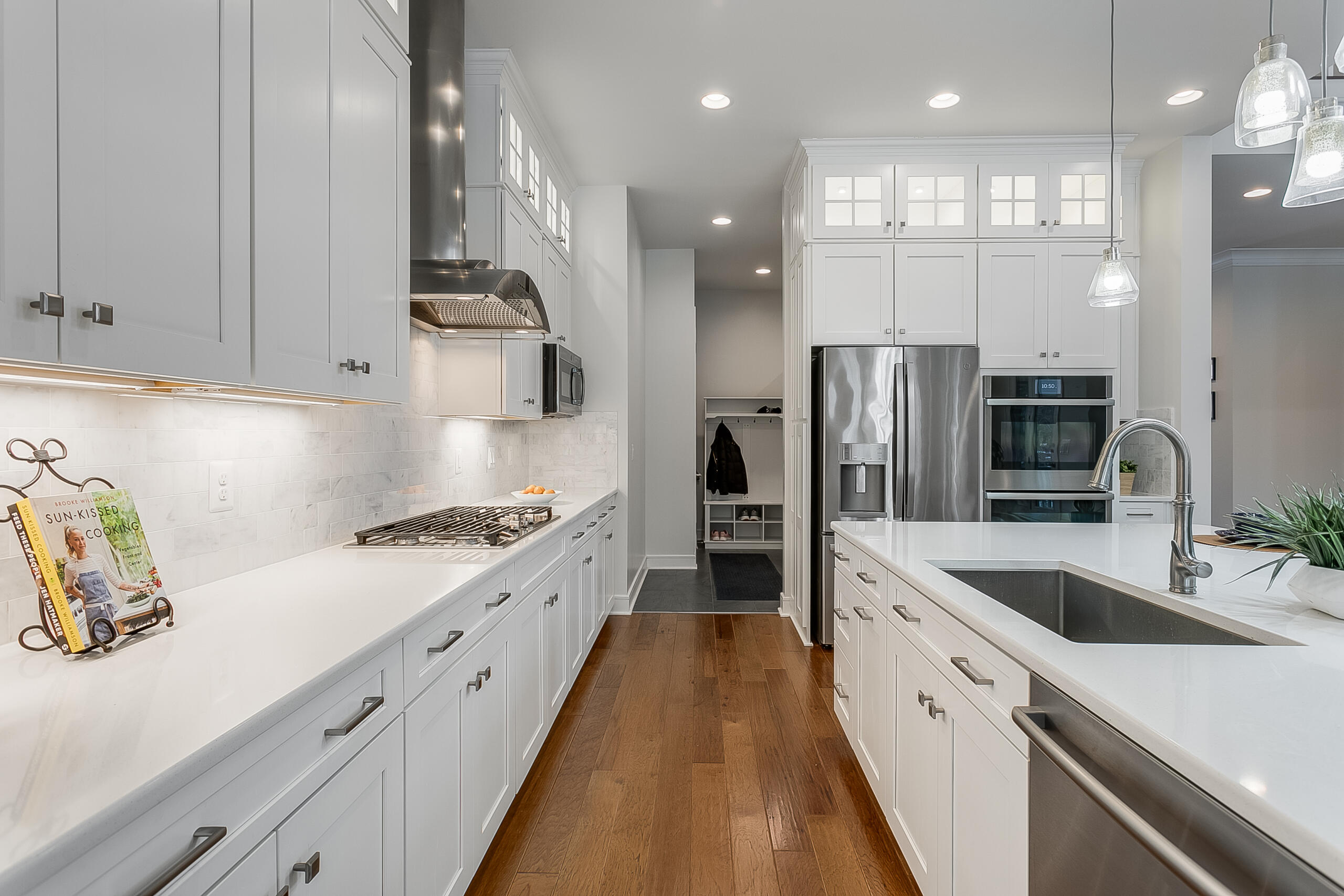 1011 Justinian Street Leesburg, VA 20175 - Photo 9 of 56 a large kitchen with stainless steel appliances granite countertop a sink a stove and a refrigerator