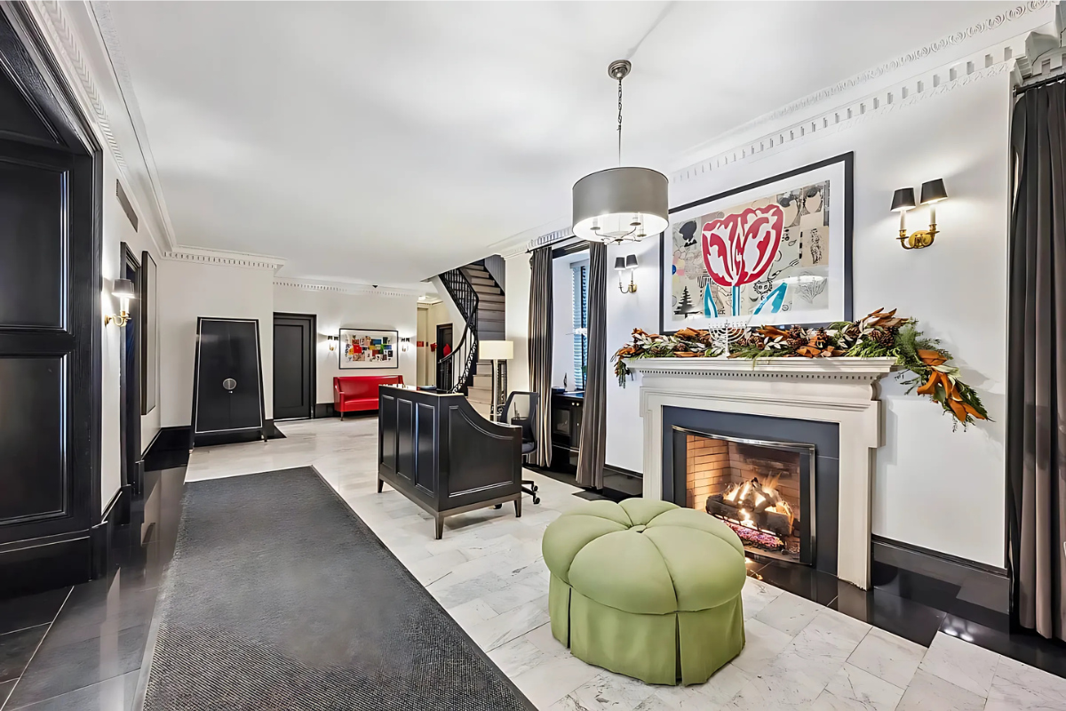25 5th Avenue, Unit 6C Manhattan, NY 10003 - Photo 15 of 16 a living room with furniture and a fireplace