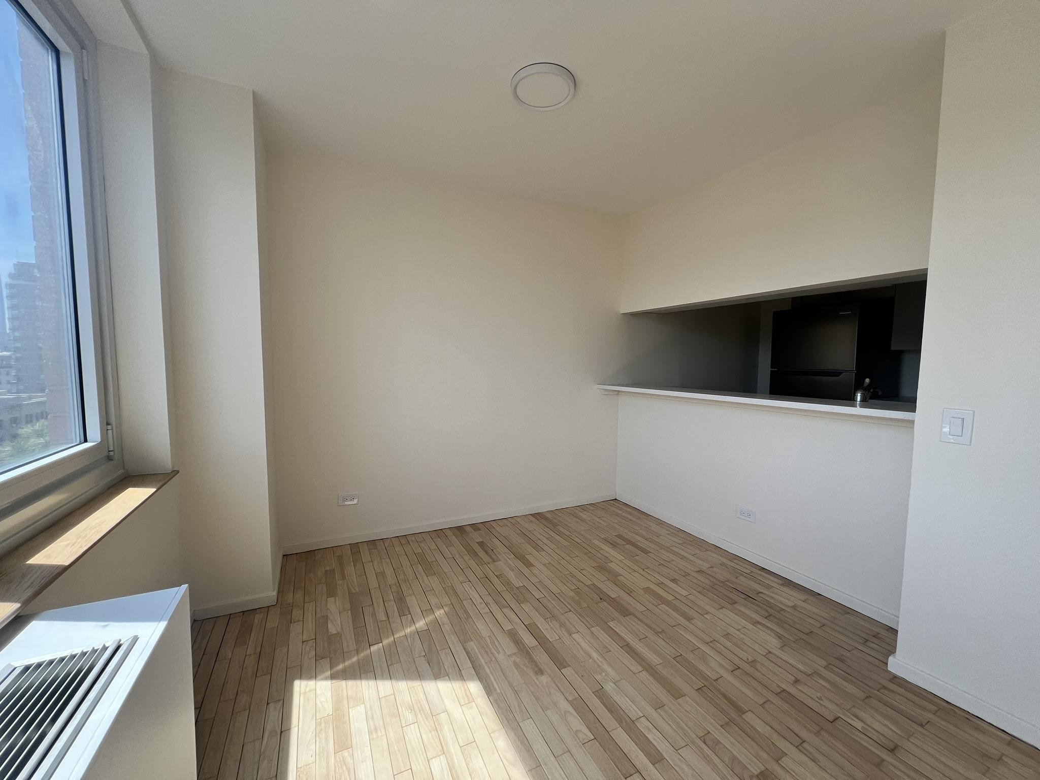 250 West 90th Street, Unit PH2F Manhattan, NY 10024 - Photo 16 of 21 a view of empty room with wooden floor and fan