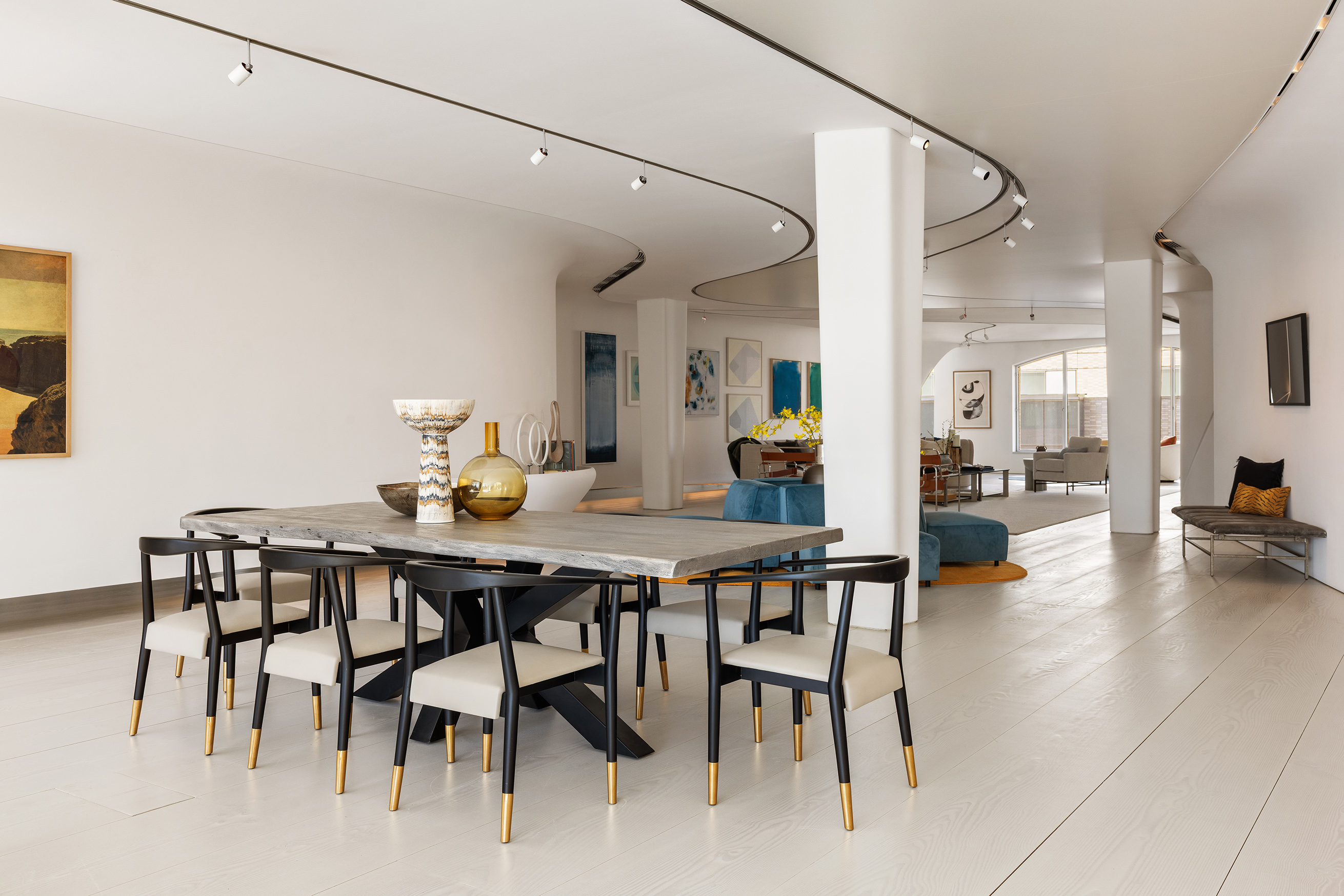 12 East 12th Street, Unit 9NS Manhattan, NY 10003 - Photo 4 of 21 a view of a dining room with furniture and a chandelier