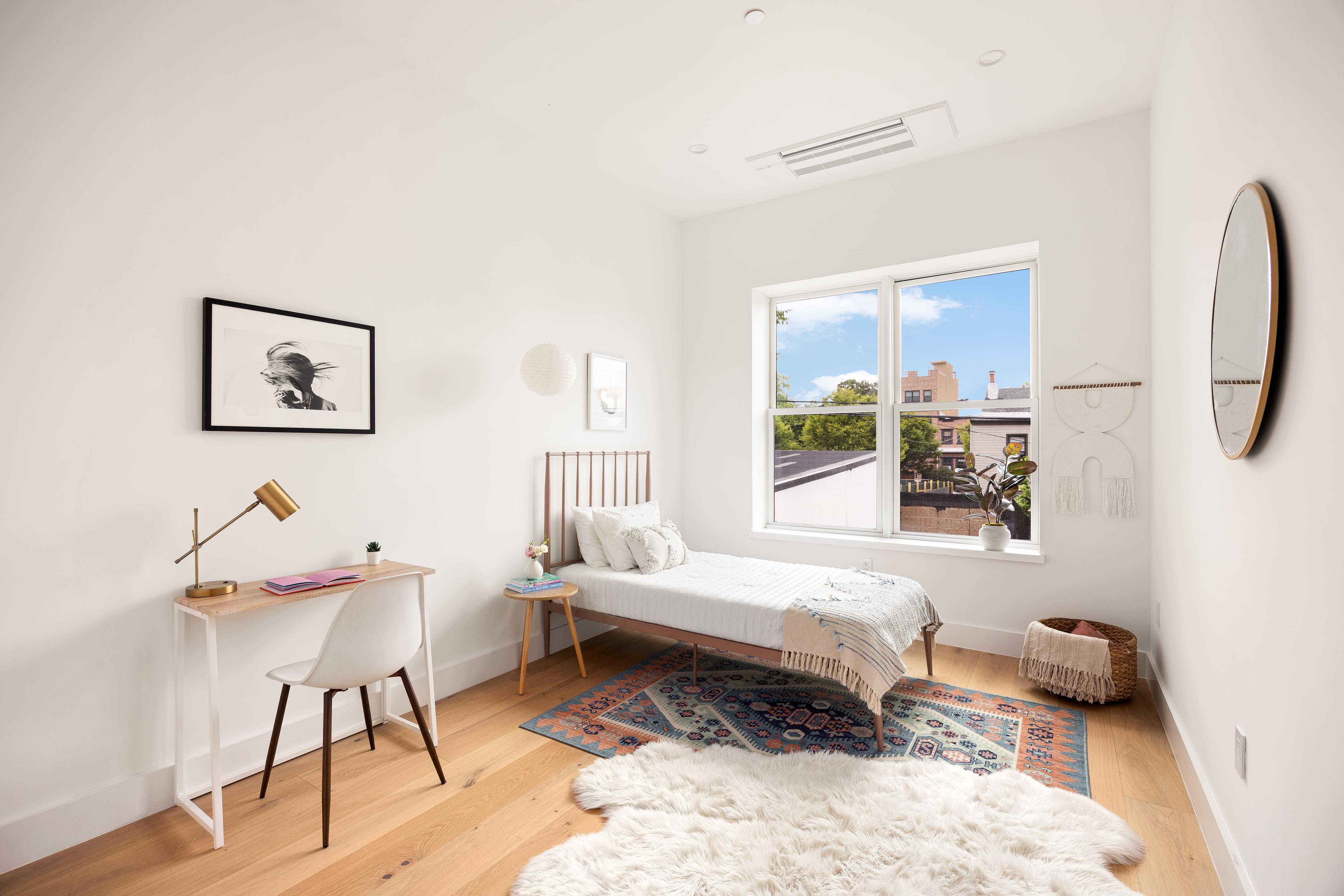 282 17th Street, Unit 2 Brooklyn, NY 11215 - Photo 7 of 11 a bedroom with a bed and a window