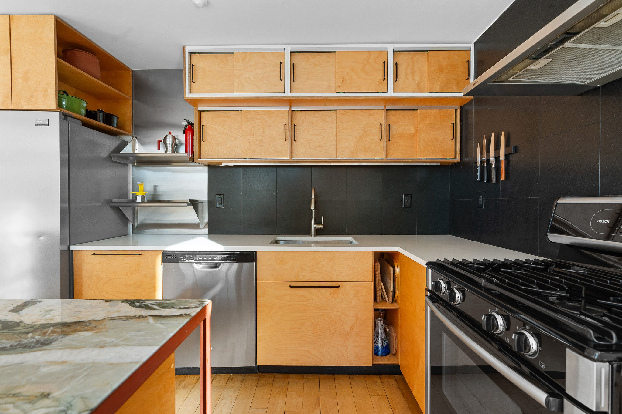 82 Guernsey Street, Unit 3B Brooklyn, NY 11222 - Photo 8 of 18 a kitchen with a stove and a microwave