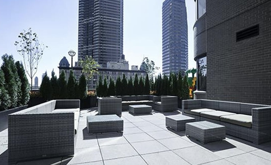 330 East 38th Street, Unit 38I Manhattan, NY 10016 - Photo 16 of 17 a view of a patio with couches and potted plants