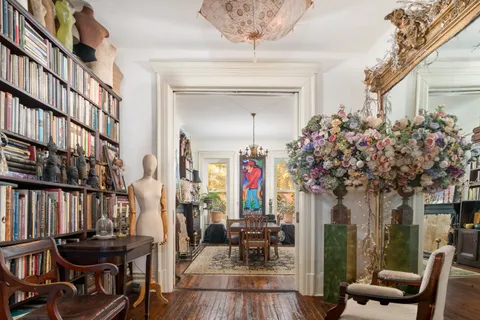 a vase of flowers sitting on a table in a living room