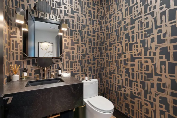 a bathroom with a double vanity sink toilet mirror and shower