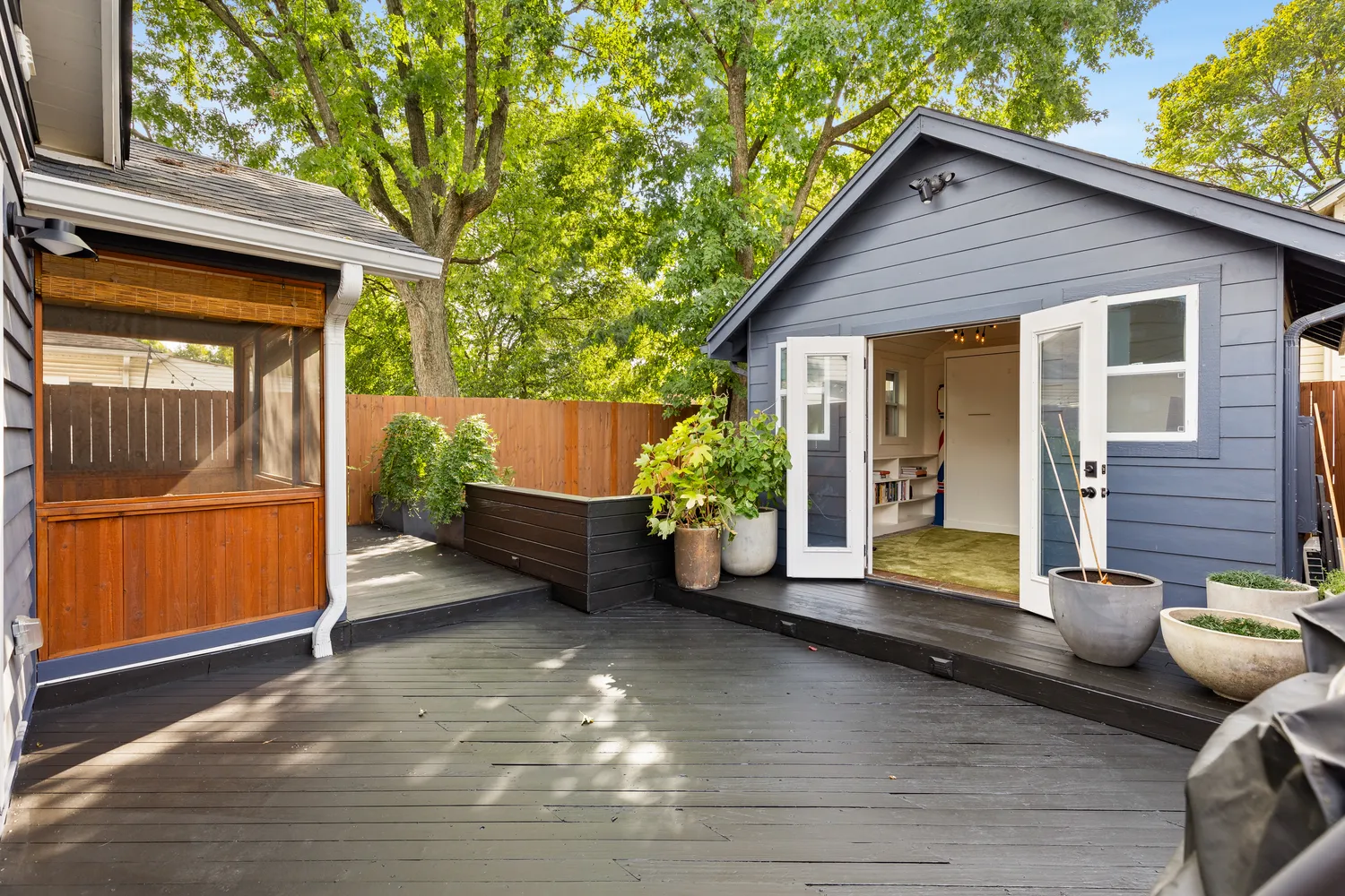 a living room with furniture a flat screen tv and a table