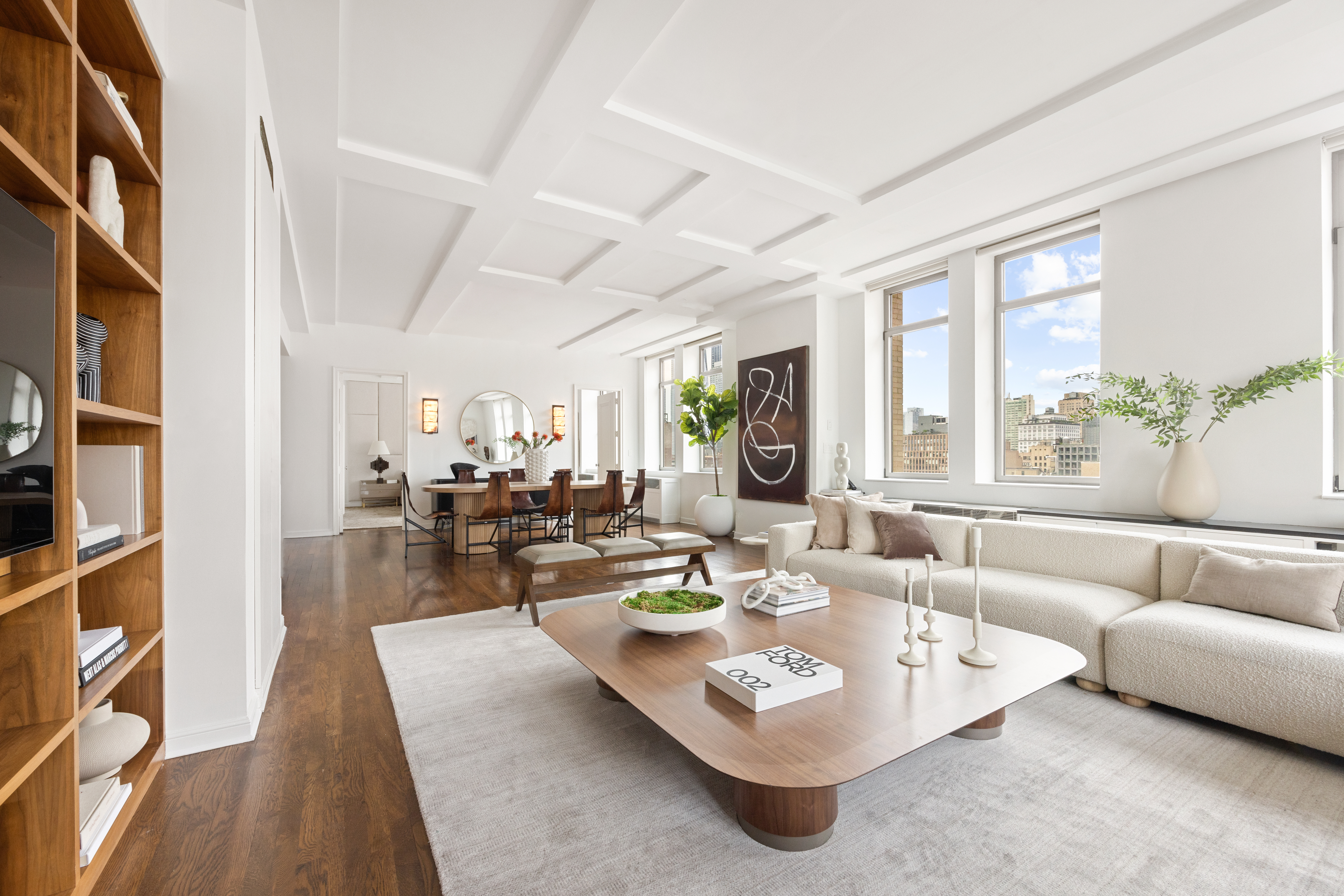 252 7th Avenue, Unit 17I Manhattan, NY 10001 - Photo 2 of 17 a living room with furniture and a large window