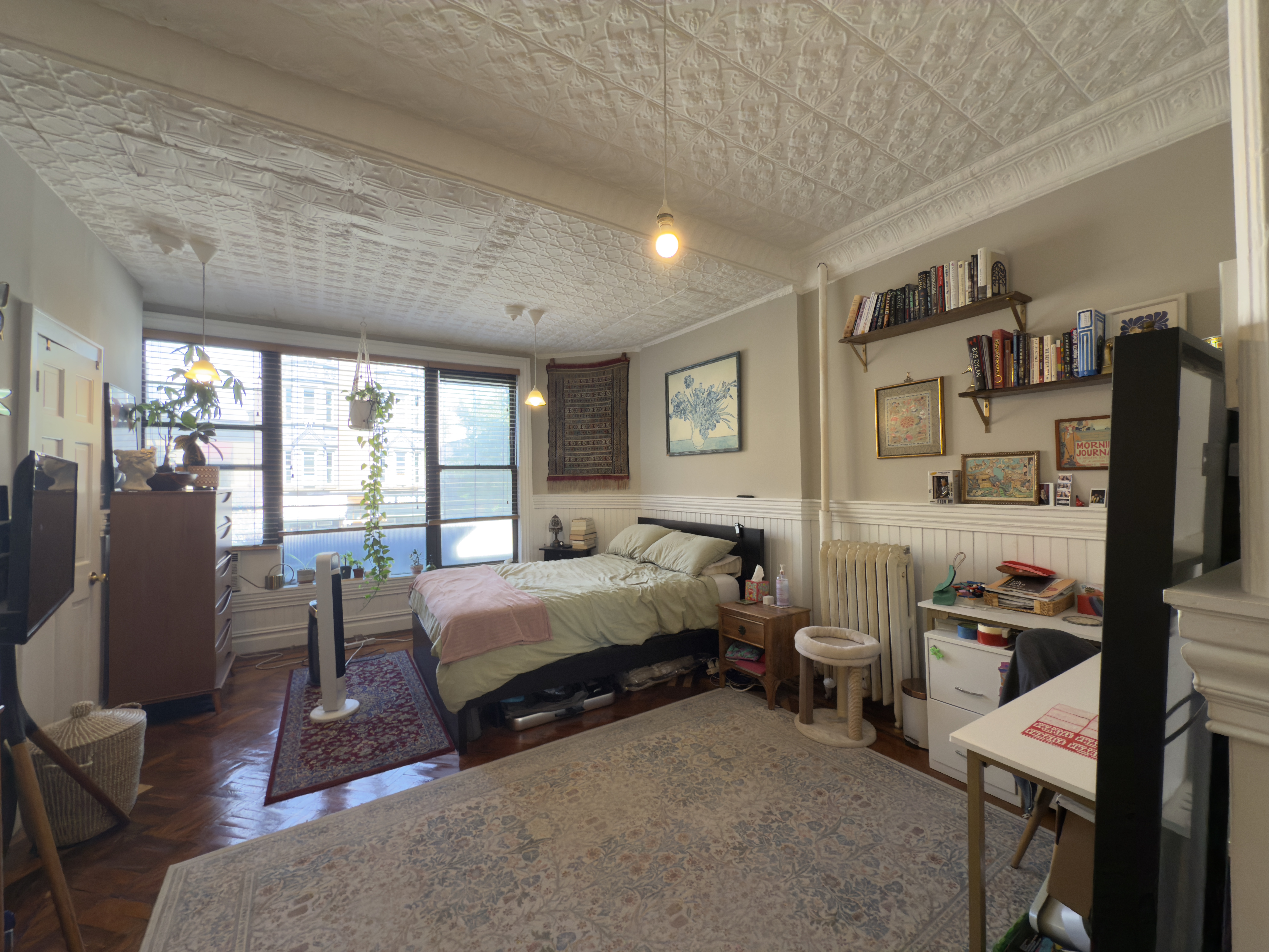 141 7th Avenue, Unit 1 Brooklyn, NY 11215 - Photo 9 of 16 a bed room with a bed and a flat tv screen