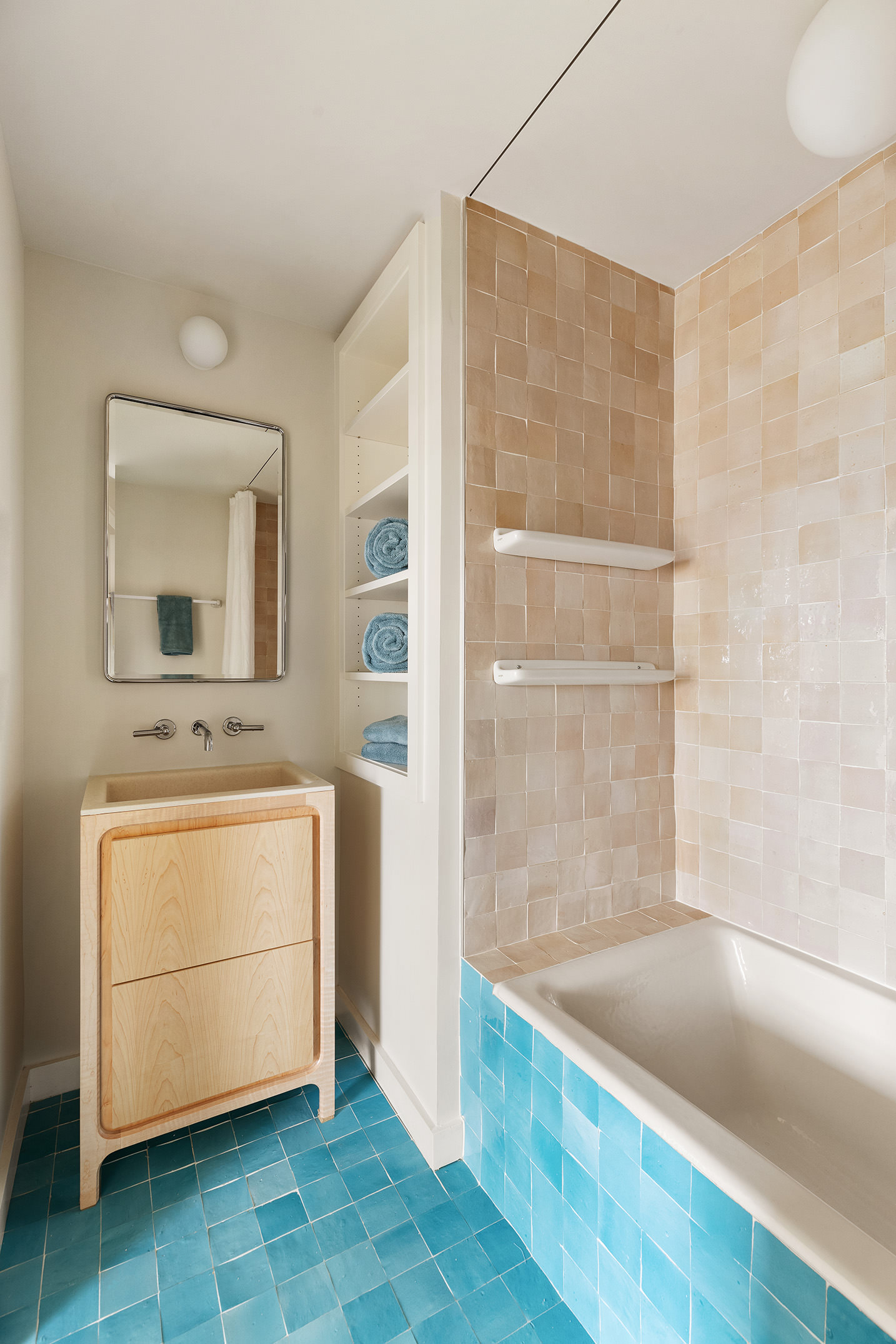 99 Avenue B, Unit PHDE Manhattan, NY 10009 - Photo 15 of 18 a bathroom with a tub sink and mirror