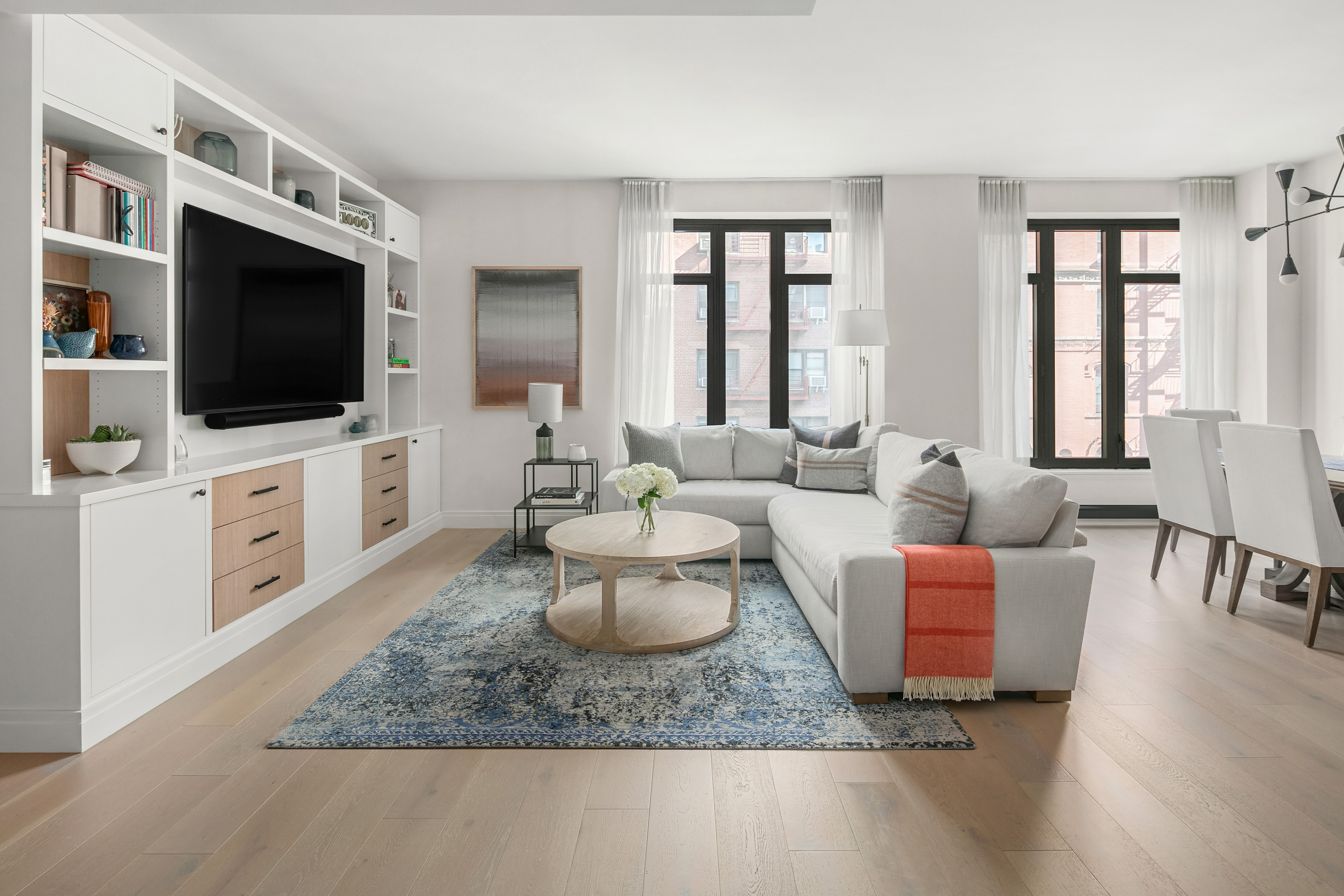 212 West 95th Street, Unit 4B Manhattan, NY 10025 - Photo 1 of 13 a living room with furniture and a flat screen tv