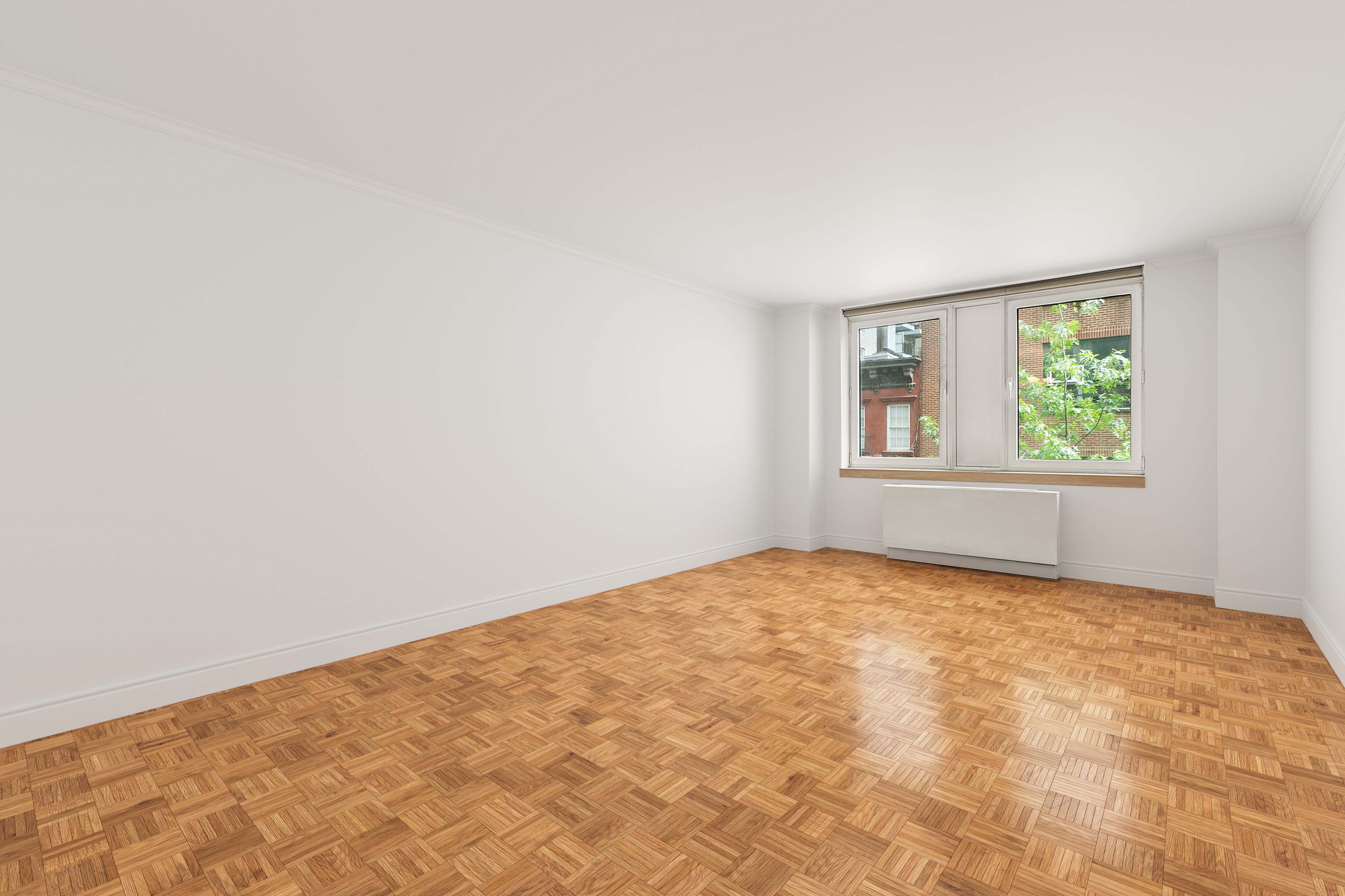 404 East 76th Street, Unit 4H Manhattan, NY 10021 - Photo 2 of 10 an empty room with a window