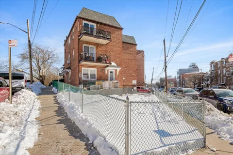 a front view of a house with sitting area