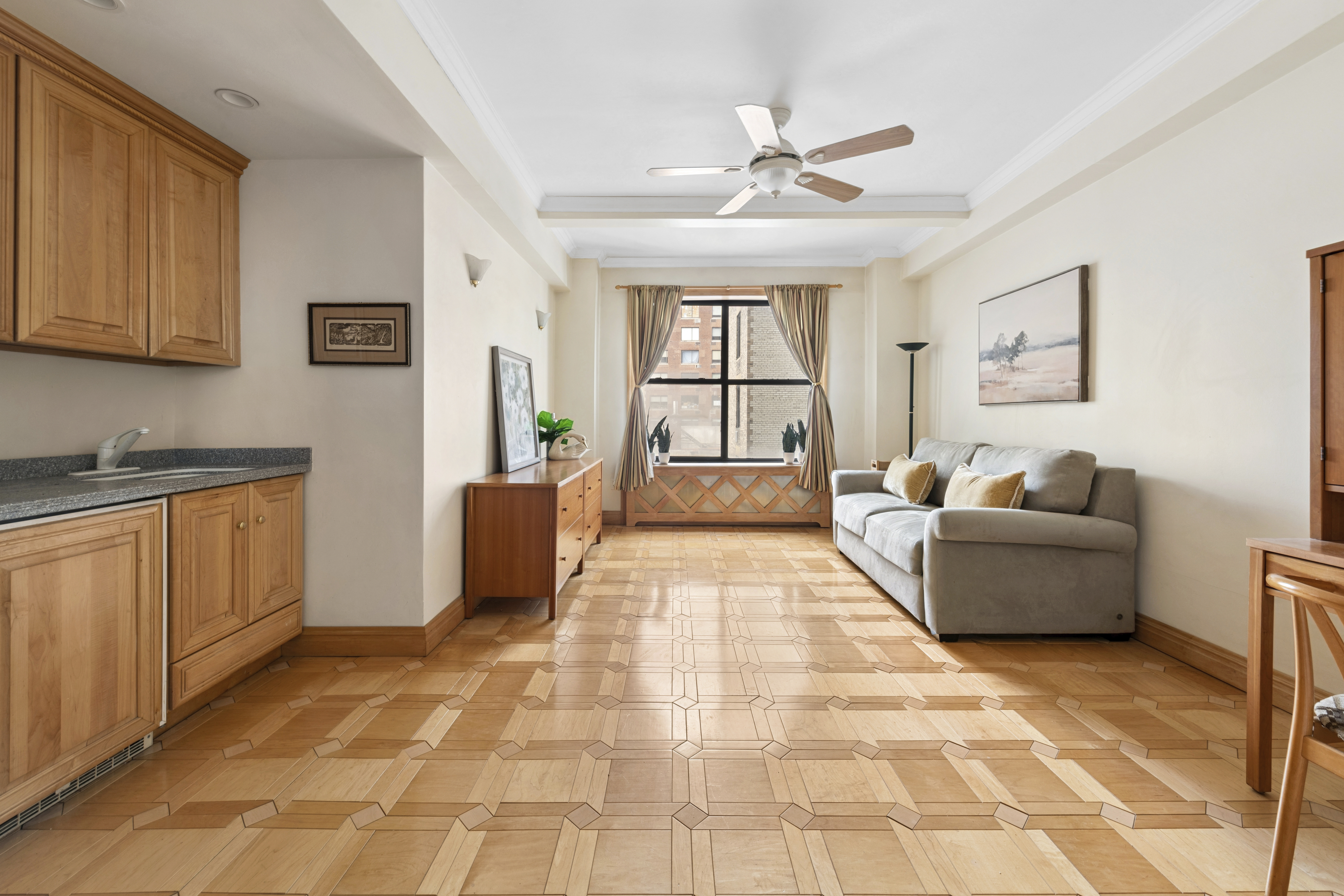 225 Central Park West, Unit 916 Manhattan, NY 10024 - Photo 4 of 13 a living room with furniture and a window