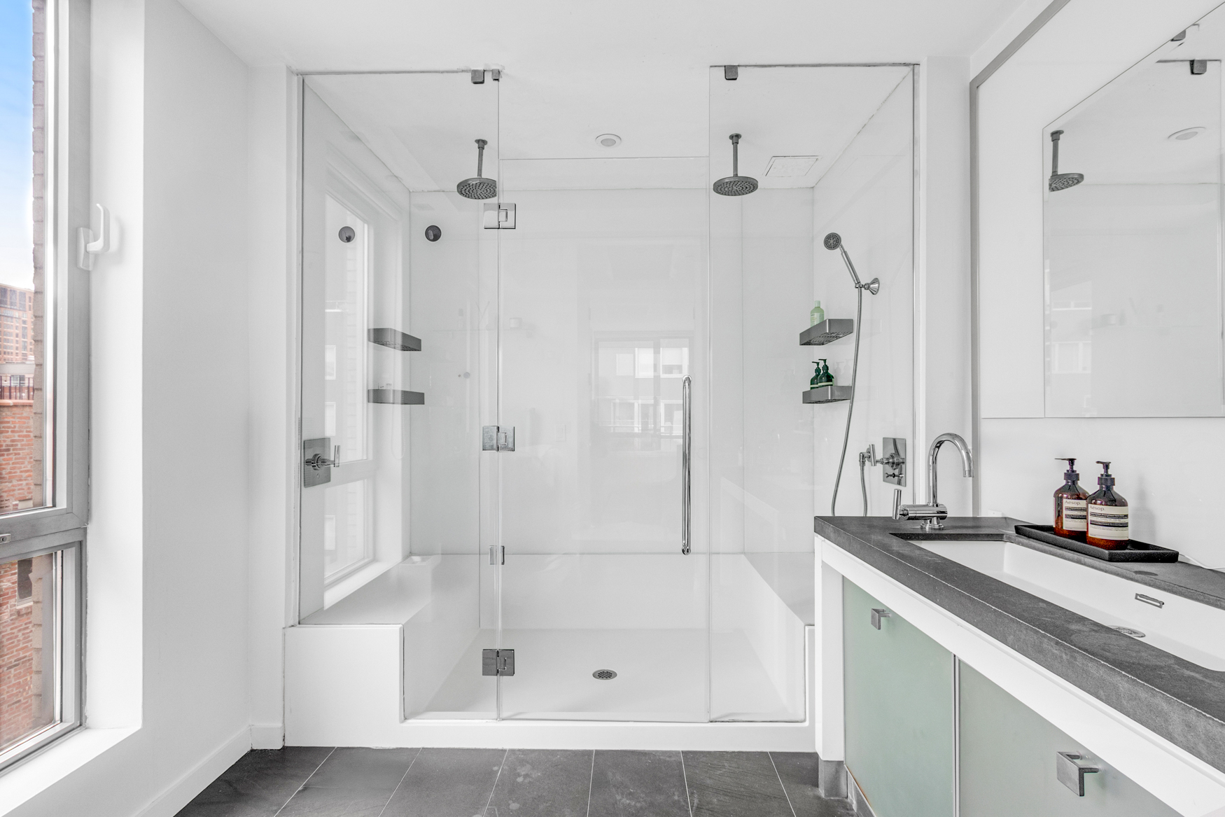 444 West 19th Street, Unit 701 Manhattan, NY 10011 - Photo 4 of 11 a bathroom with a shower and a sink