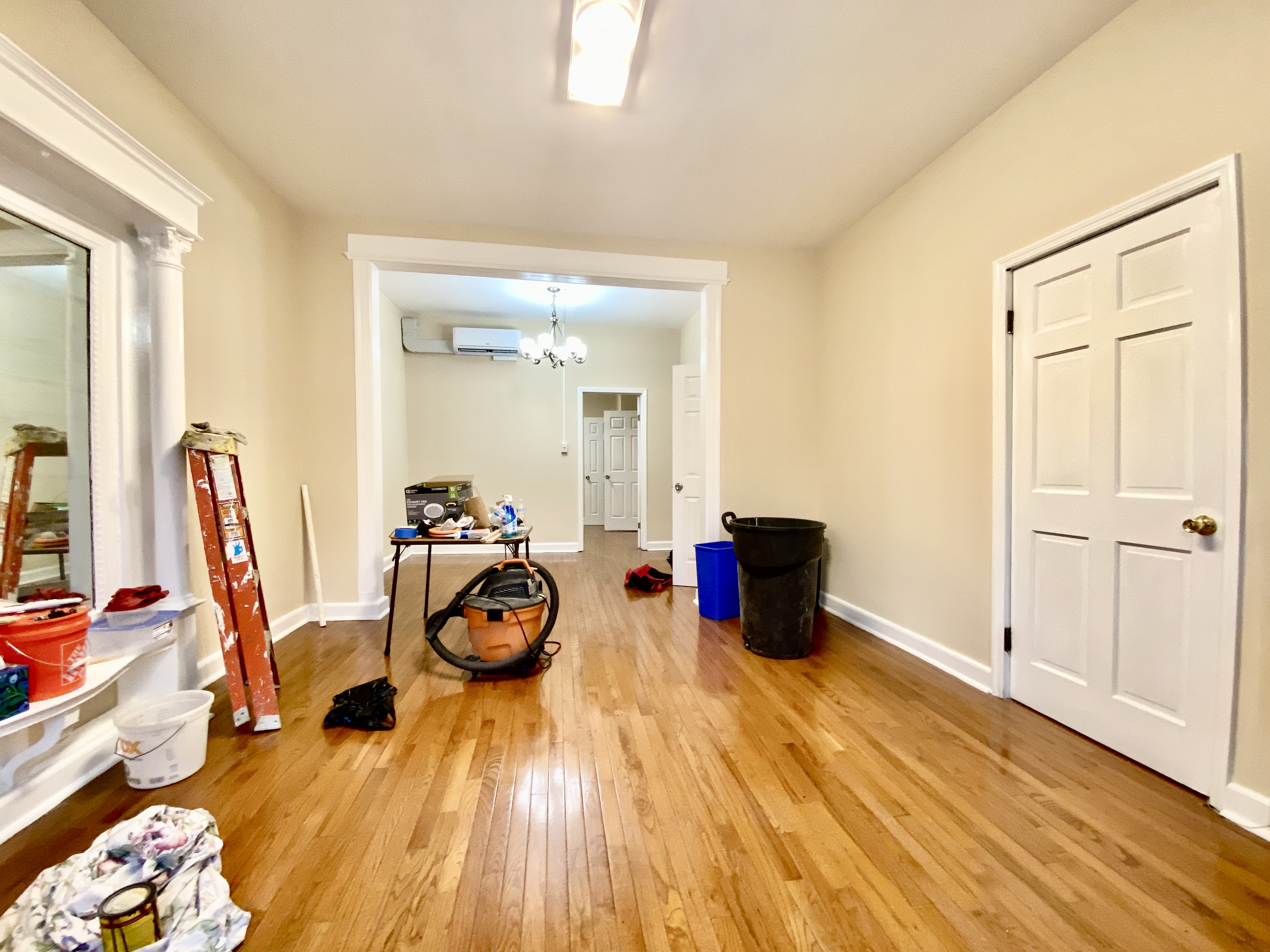 a room with wooden floor and furniture
