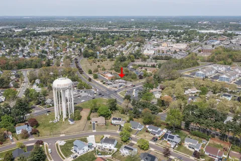 an aerial view of residential houses with city view