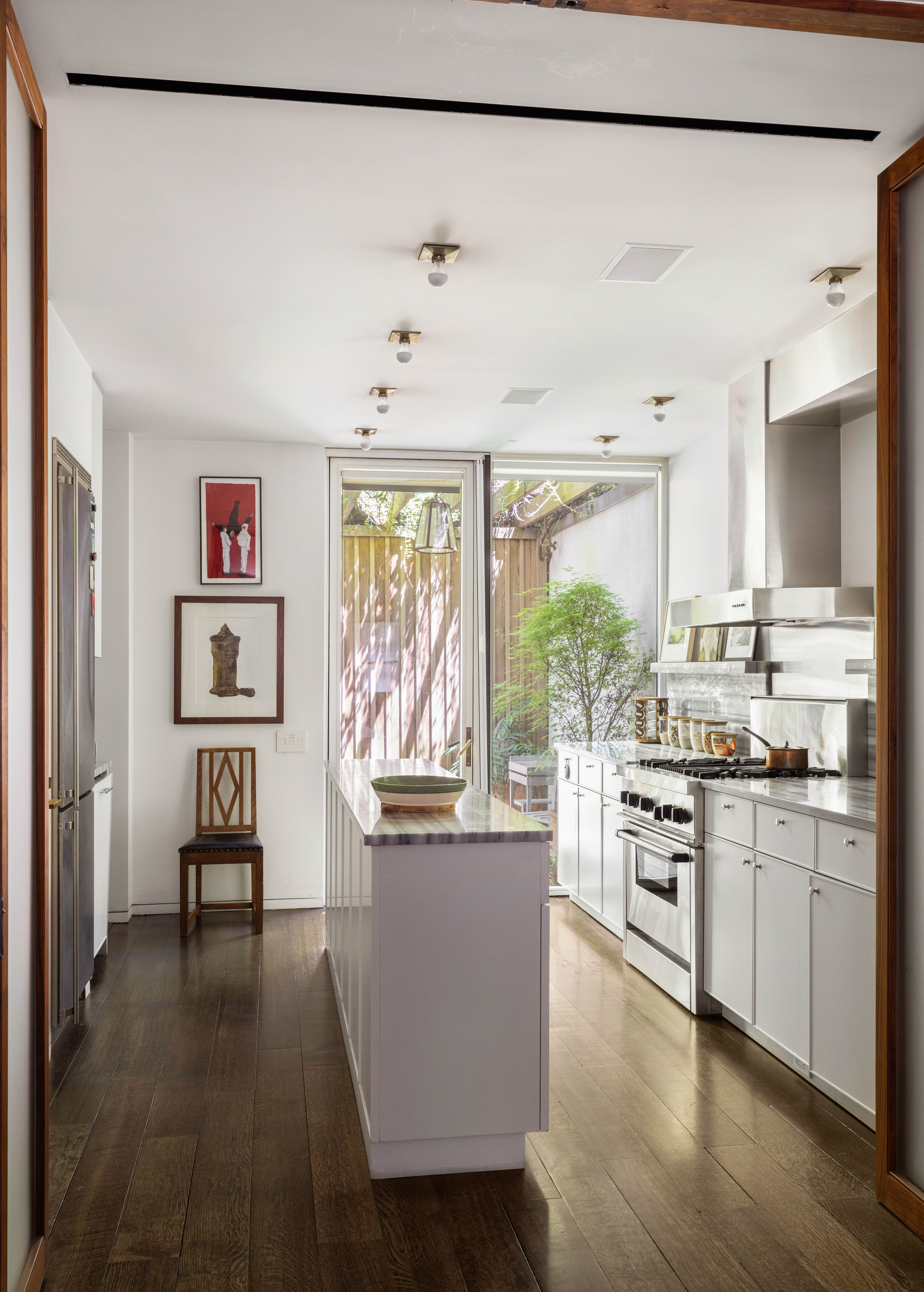 7 MacDougal Alley Manhattan, NY 10011 - Photo 12 of 25 a kitchen with stainless steel appliances granite countertop a refrigerator and a stove top oven