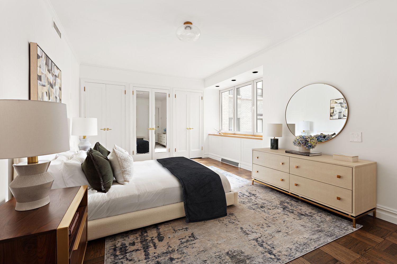 900 5th Avenue, Unit 4B Manhattan, NY 10021 - Photo 7 of 14 a bedroom with a bed and a dresser