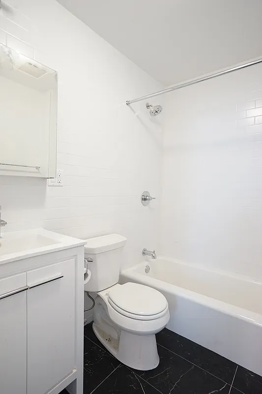 1 Luquer Street, Unit 2 Brooklyn, NY 11231 - Photo 7 of 9 a bathroom with a toilet a sink and a bathtub