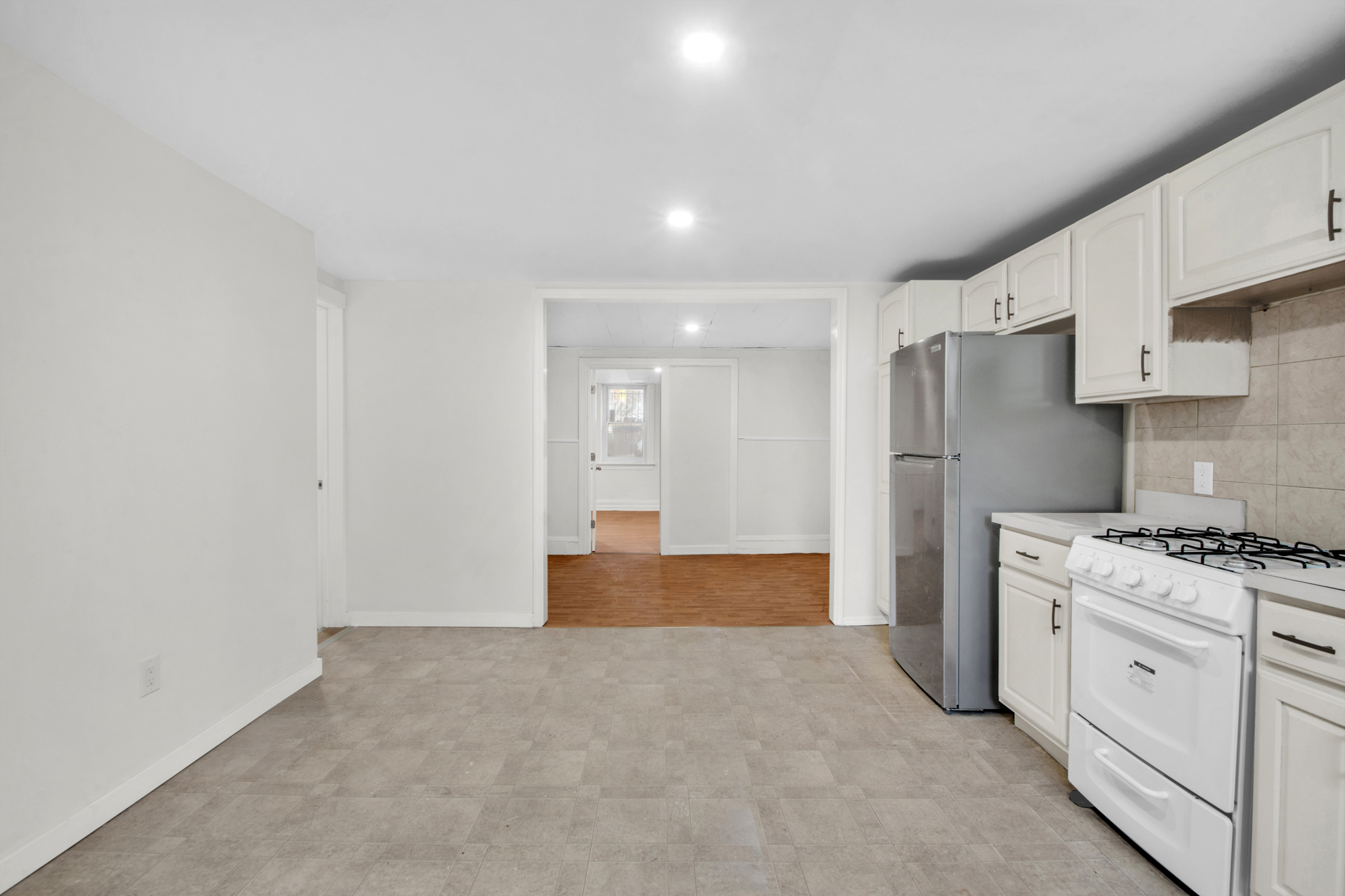 178 30th Street, Unit 1 Brooklyn, NY 11232 - Photo 5 of 6 a kitchen with cabinets and stainless steel appliances