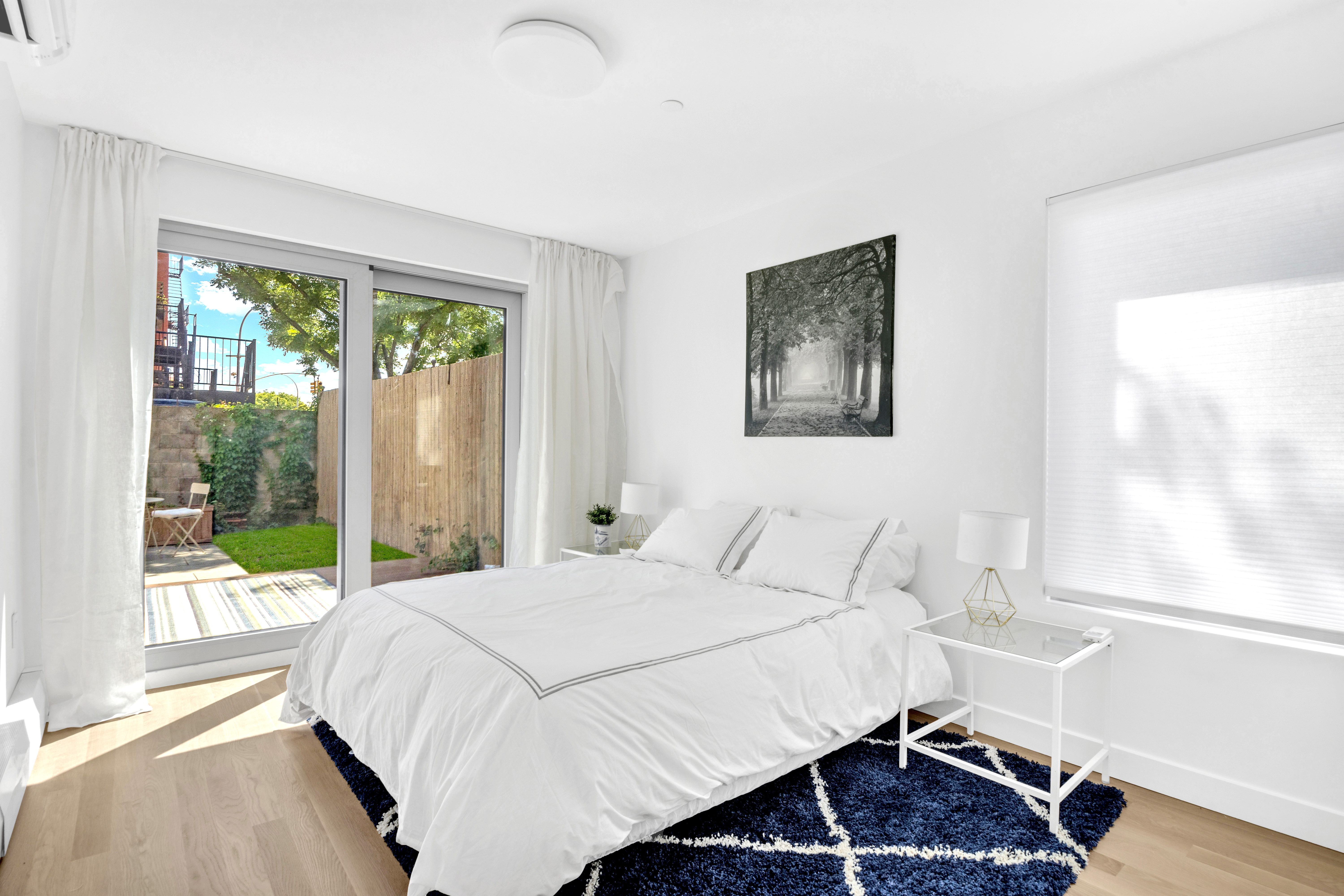 86 Baltic Street, Unit 1 Brooklyn, NY 11201 - Photo 5 of 14 a bedroom with a bed and a large window