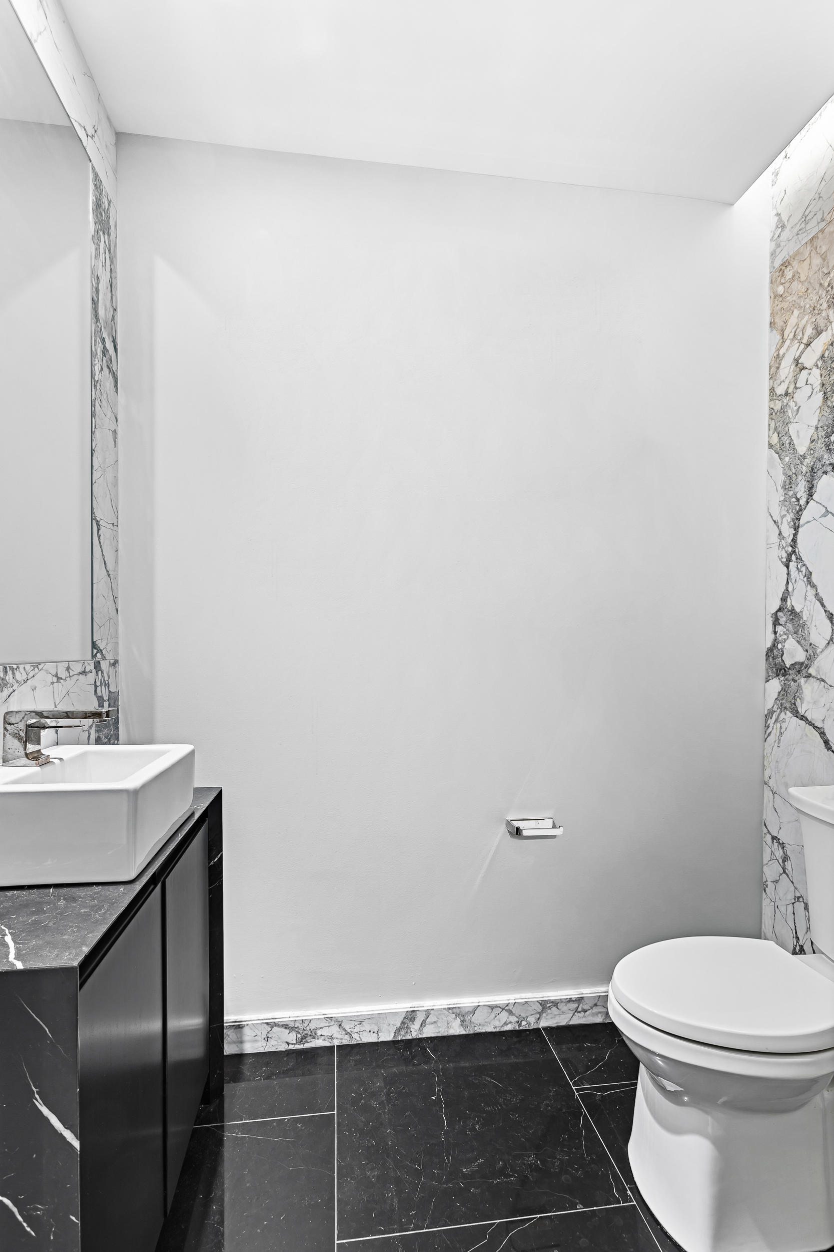138 East 50th Street, Unit 40B Manhattan, NY 10022 - Photo 13 of 22 a bathroom with a sink and a toilet