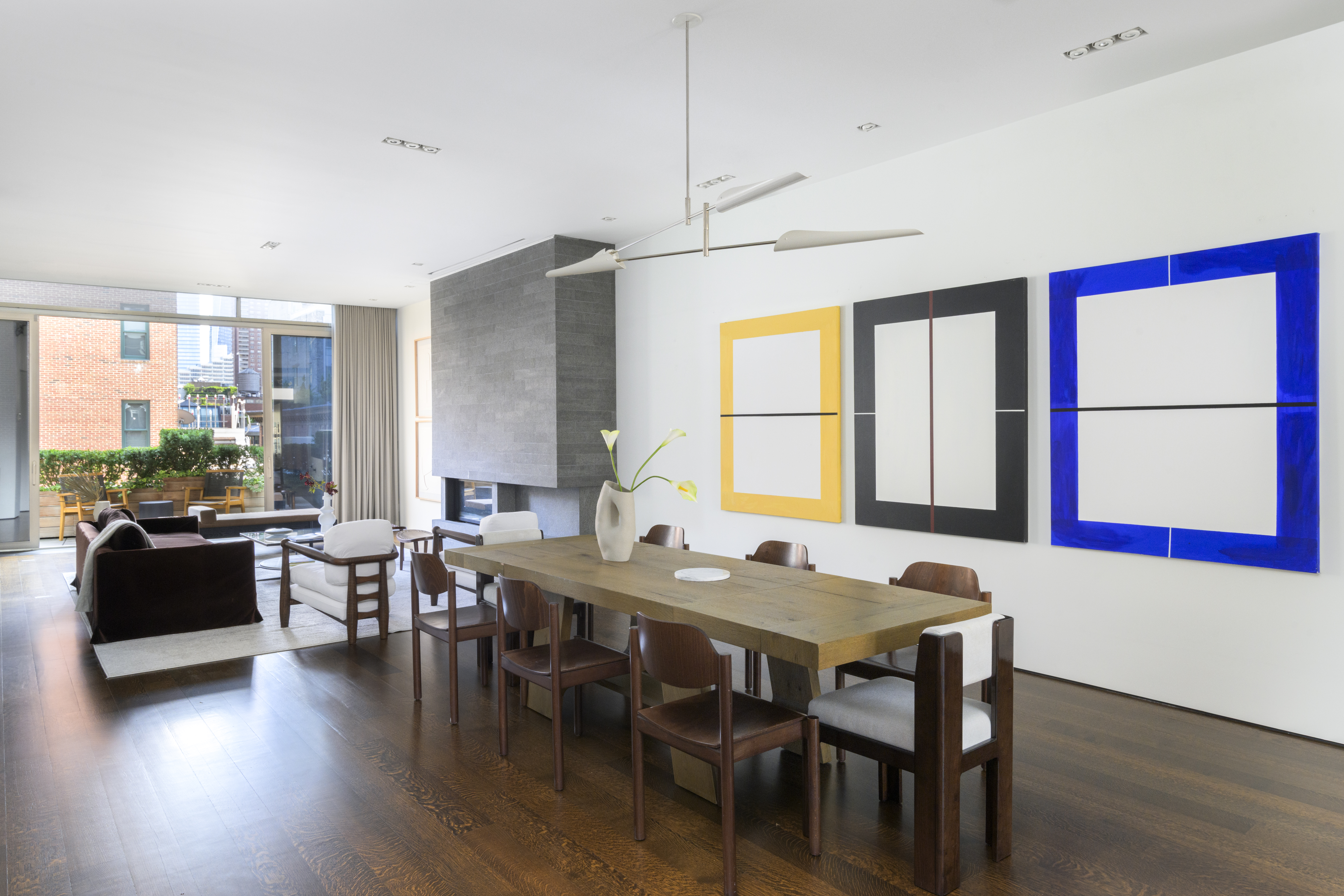 33 Vestry Street Manhattan, NY 10013 - Photo 3 of 16 a view of a dining room with furniture window and wooden floor