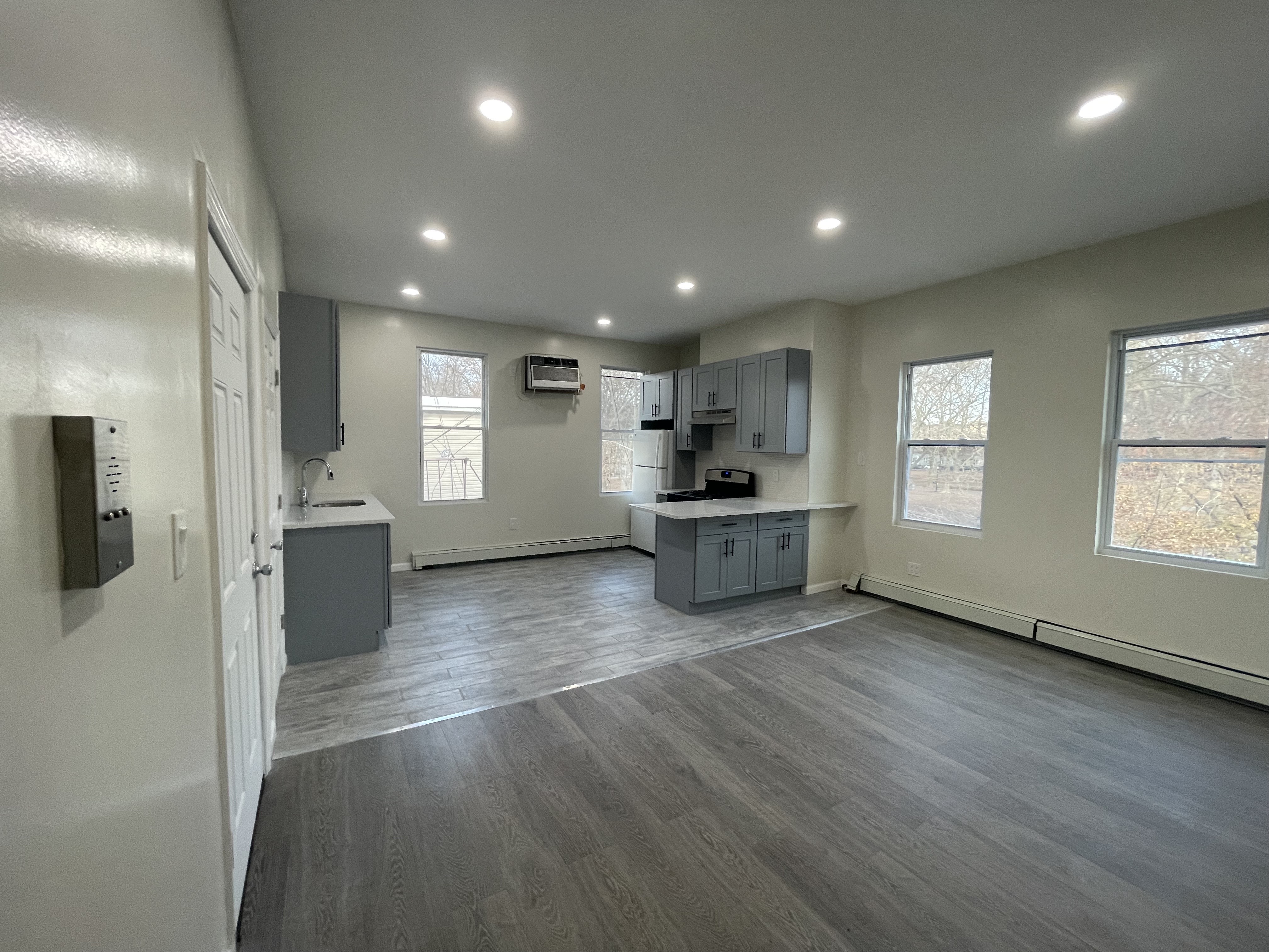 142 Driggs Avenue, Unit 3 Brooklyn, NY 11222 - Photo 2 of 8 a view of kitchen with stainless steel appliances a refrigerator and a sink