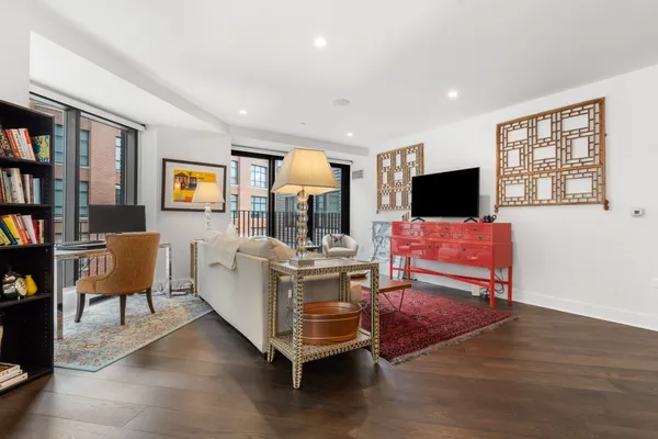 a living room with fireplace furniture and a flat screen tv