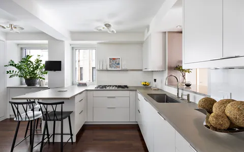 a kitchen with a table and chairs in it