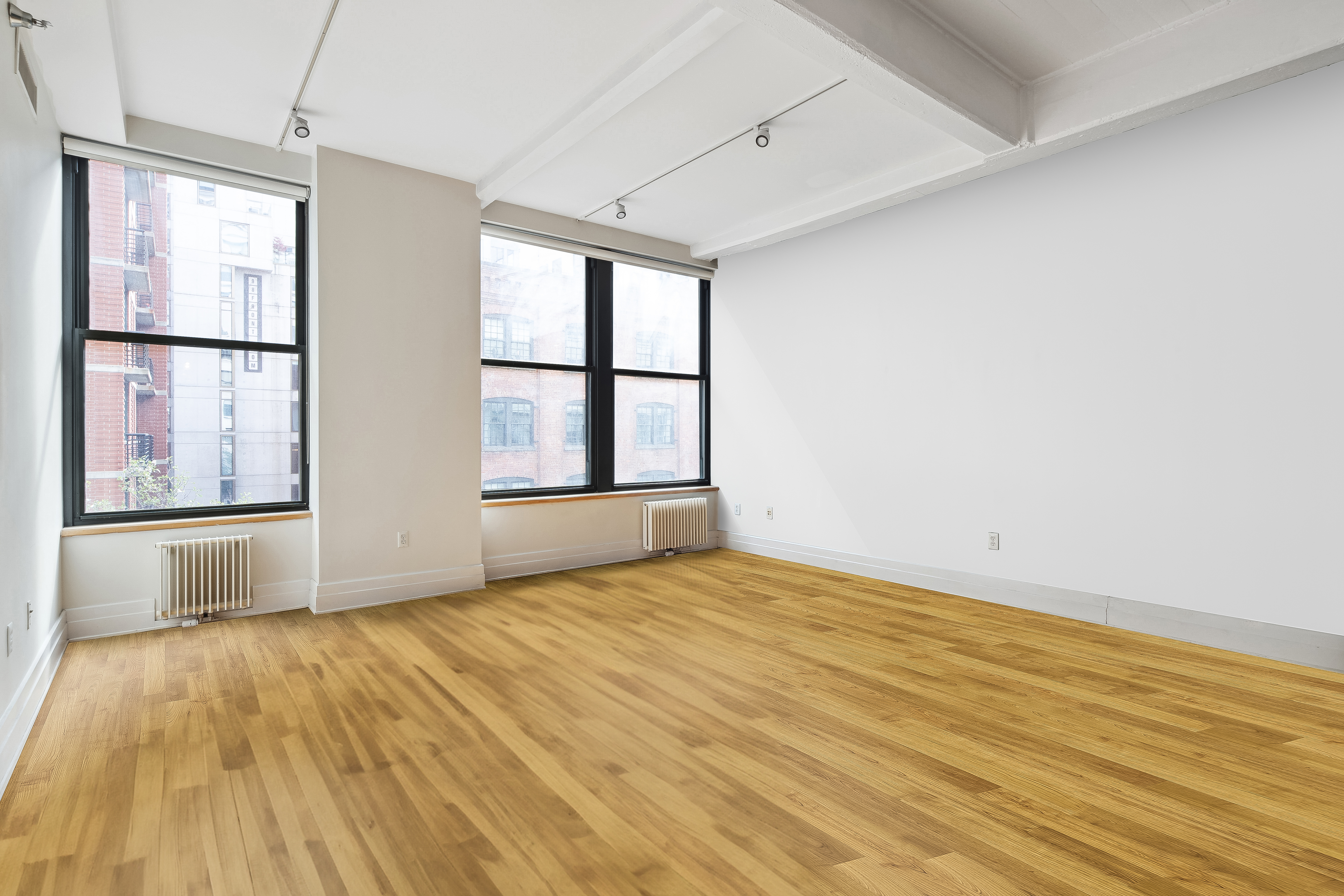 70 Washington Street, Unit 4U Brooklyn, NY 11201 - Photo 2 of 14 a view of an empty room with wooden floor and a window
