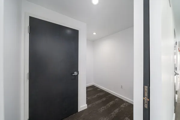 a bathroom with a sink vanity mirror and toilet