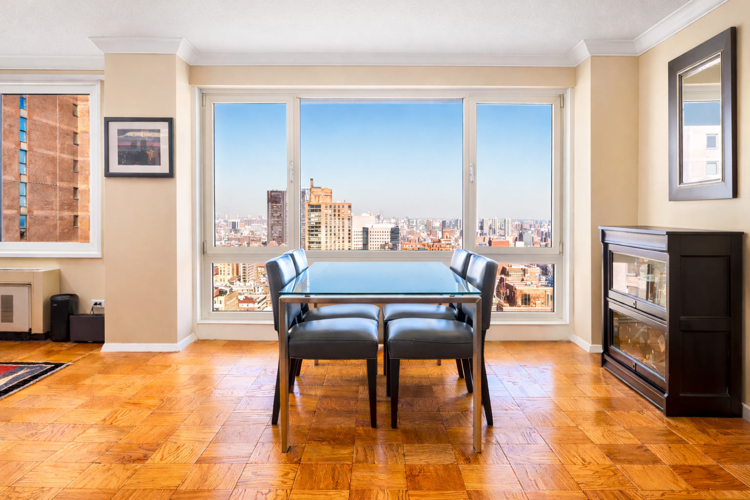 50 East 89th Street, Unit 31C Manhattan, NY 10128 - Photo 5 of 18 a dining room with furniture and window
