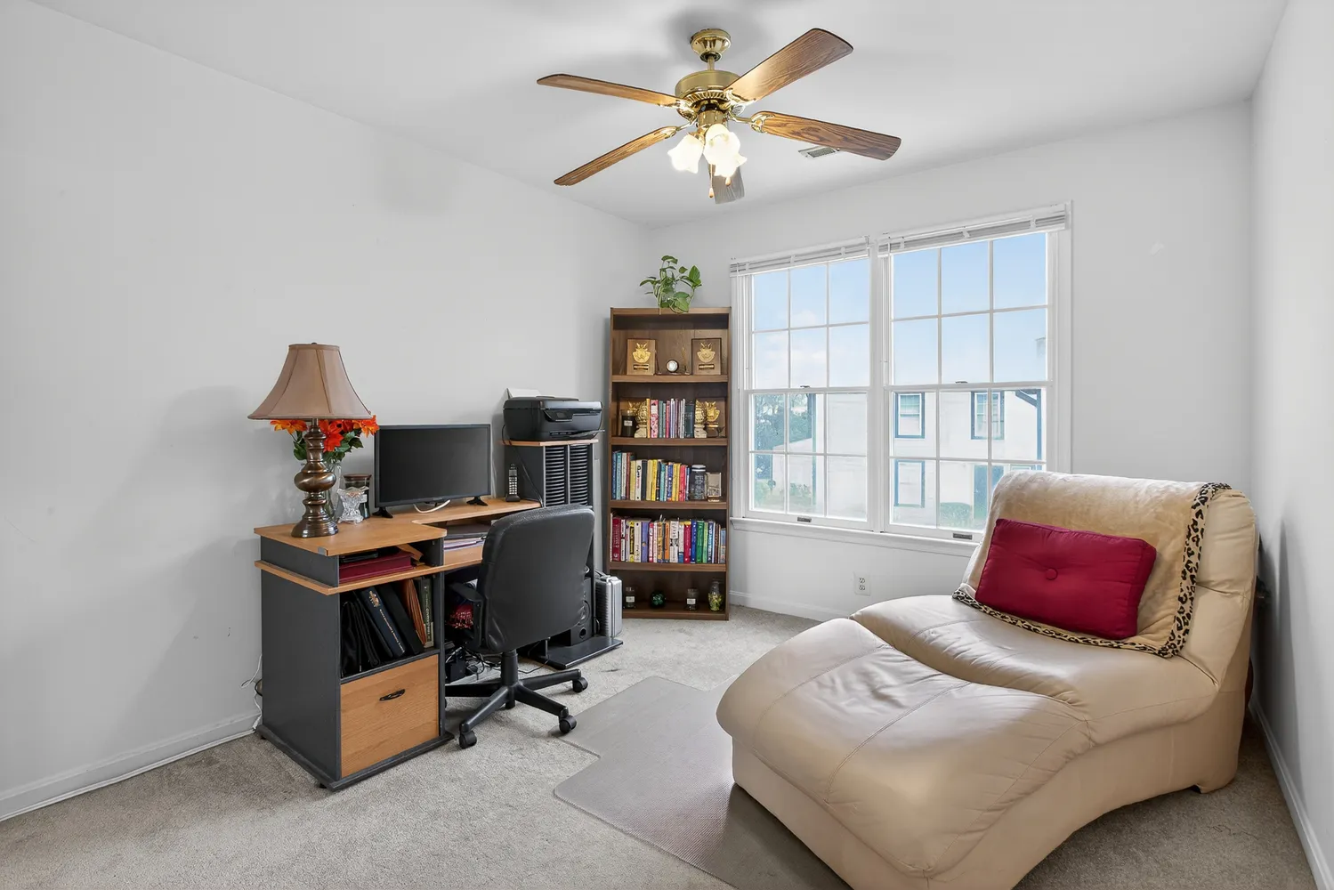 a bedroom with a workspace