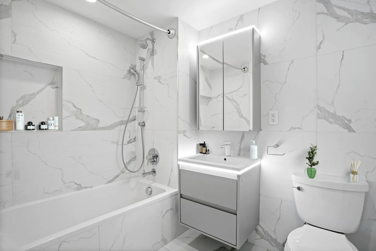 a bathroom with a sink a toilet and a bathtub