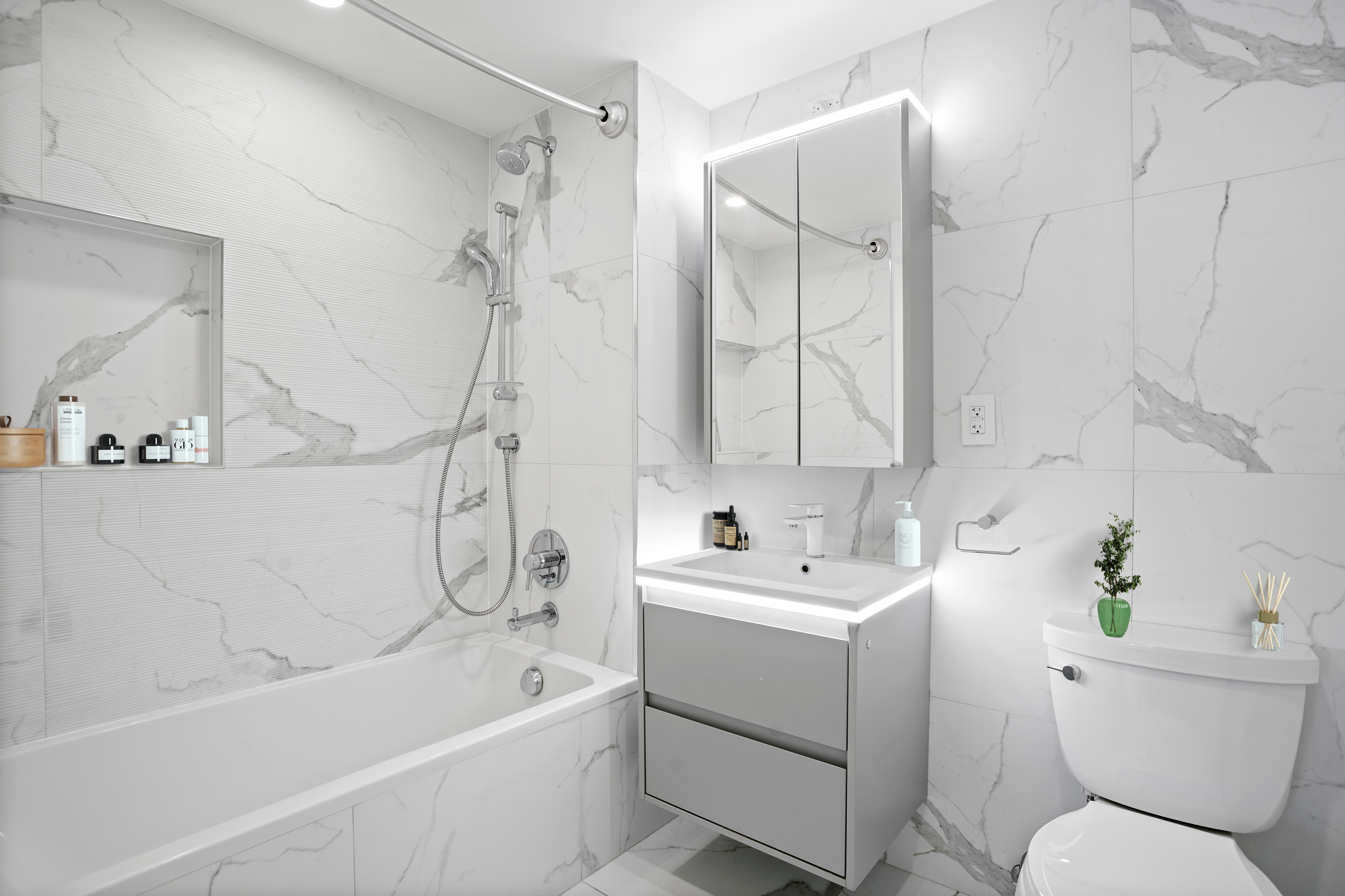 2128 Ocean Avenue, Unit 6E Brooklyn, NY 11229 - Photo 4 of 7 a bathroom with a sink a toilet and a bathtub