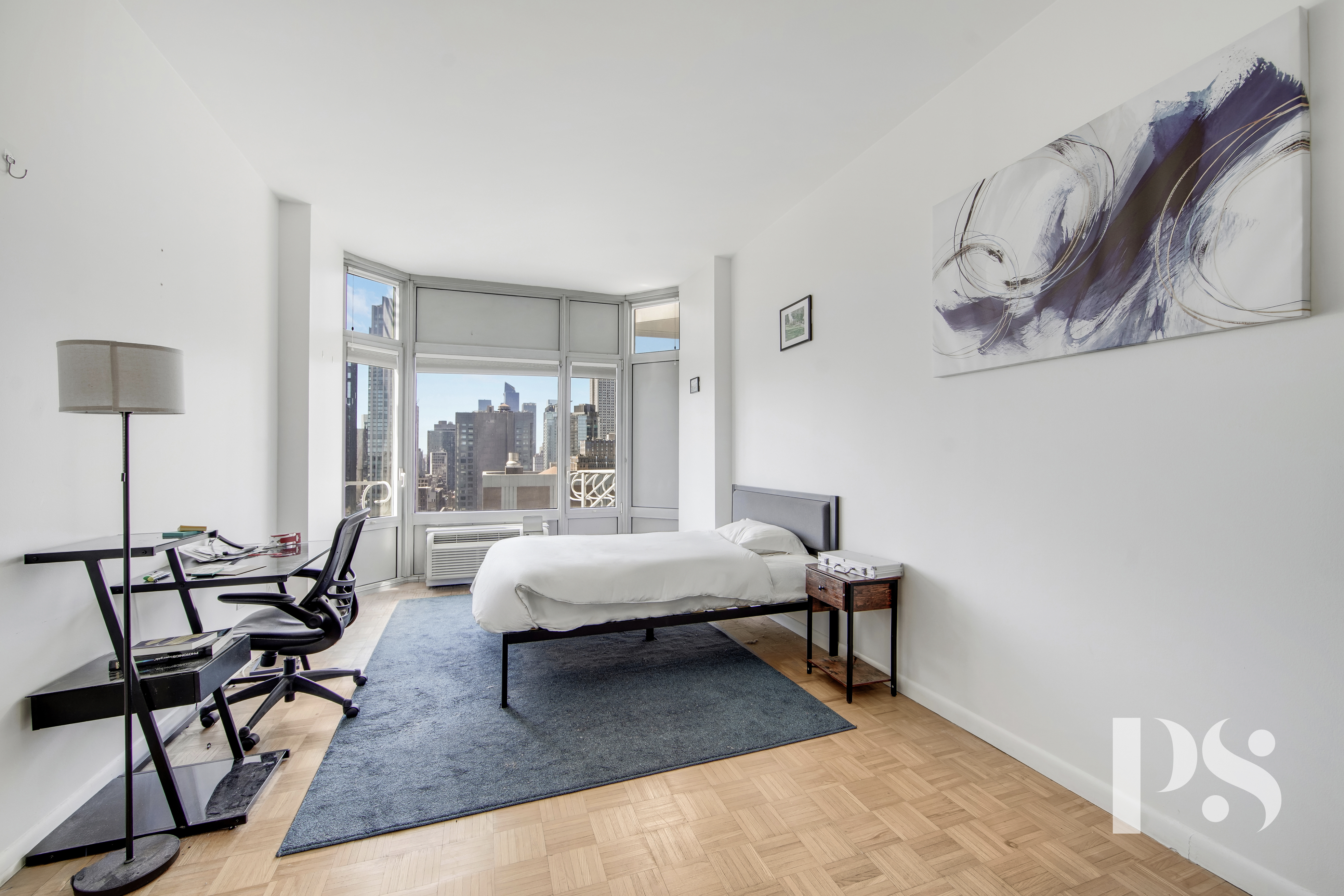 200 East 32nd Street, Unit 33C Manhattan, NY 10016 - Photo 8 of 12 a living room with furniture and a window