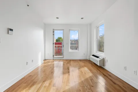 a view of an empty room with a window