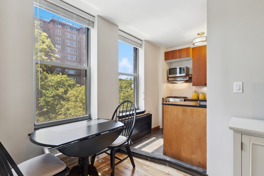 689 Fort Washington Avenue, Unit 4B Manhattan, NY 10040 - Photo 3 of 13 a dining room with furniture and a window