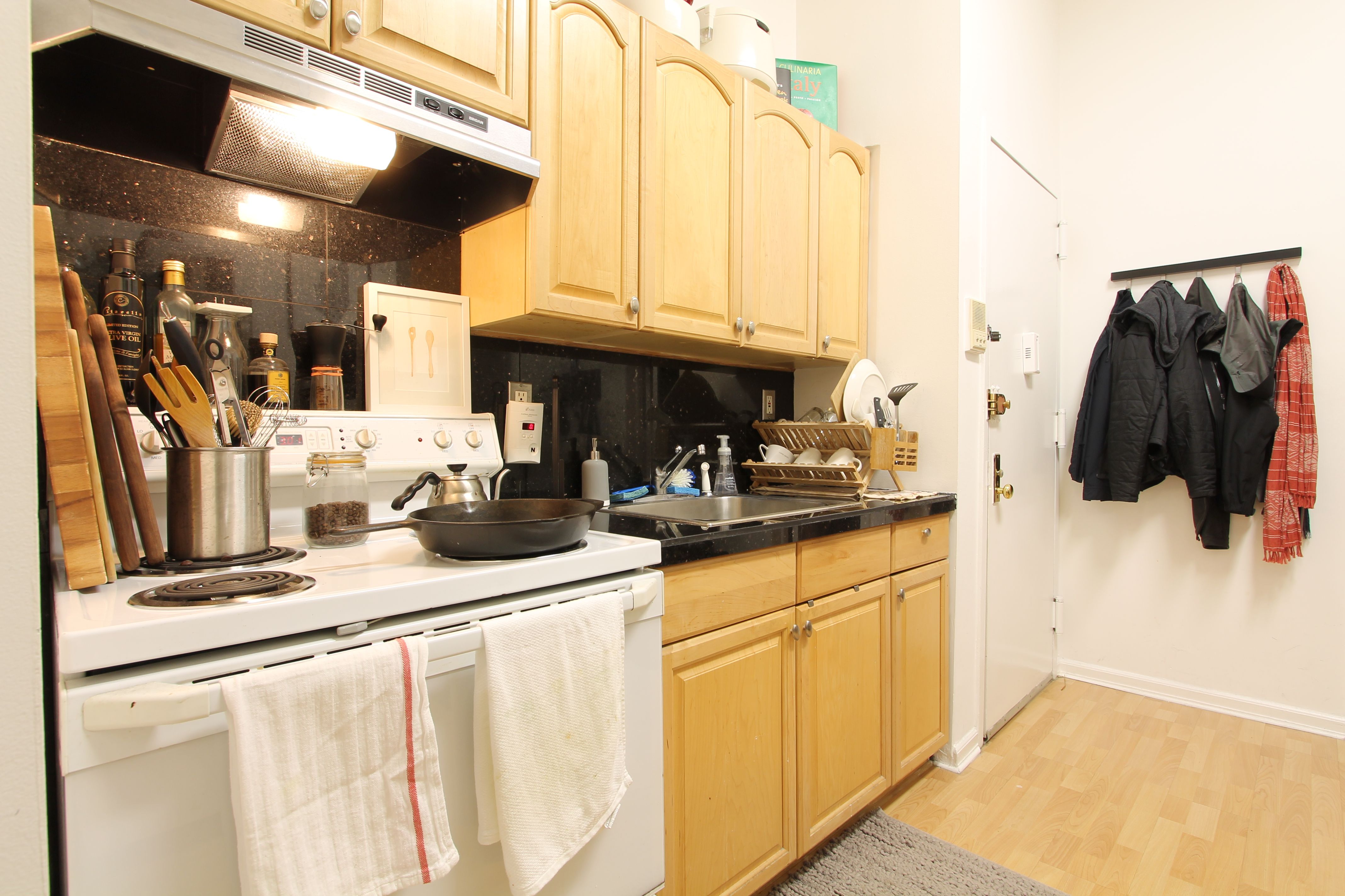 1313 3rd Avenue, Unit 2RS Manhattan, NY 10021 - Photo 3 of 4 a kitchen with a sink cabinets and a window