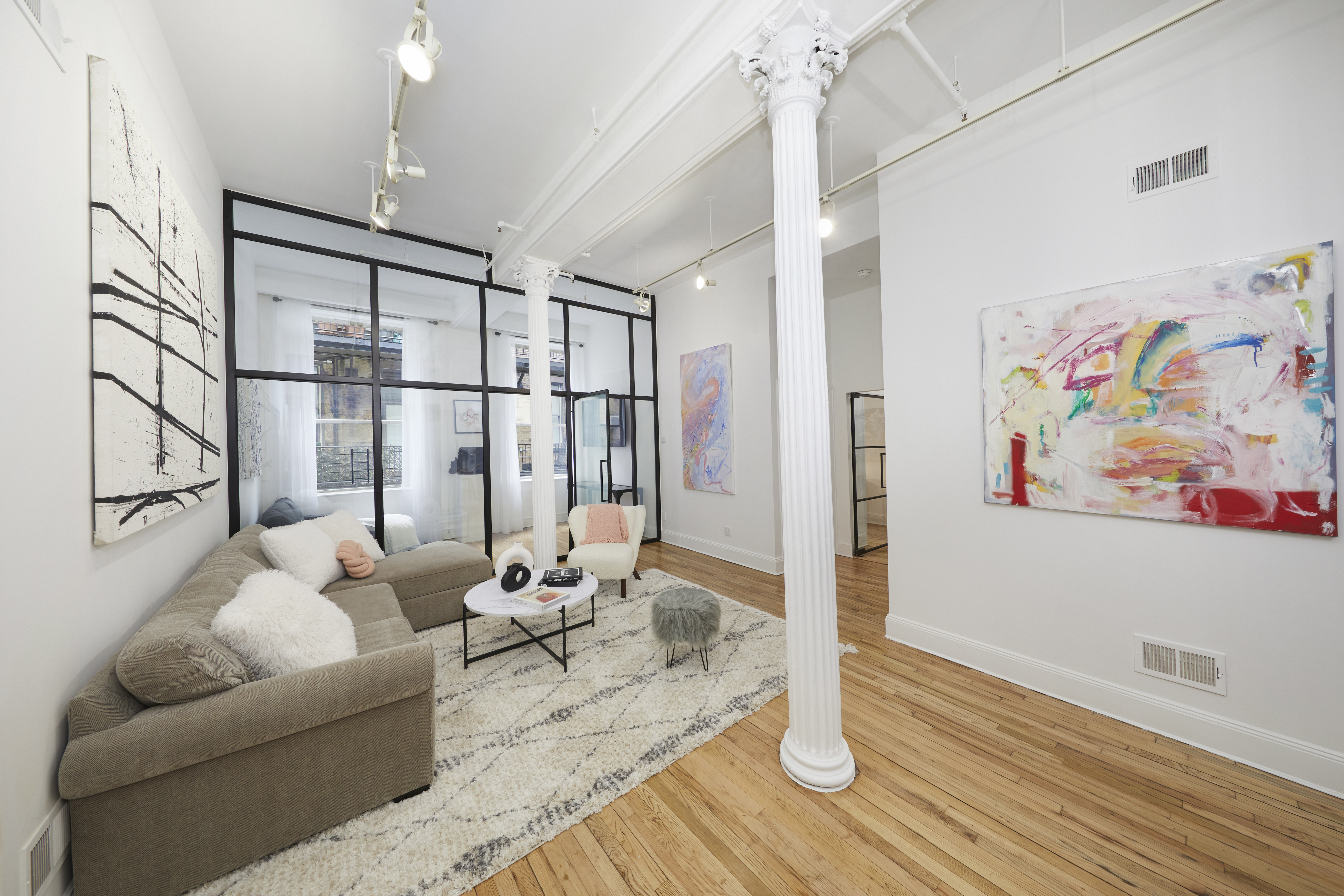 80 Leonard Street, Unit 3G Manhattan, NY 10013 - Photo 10 of 30 a living room with furniture