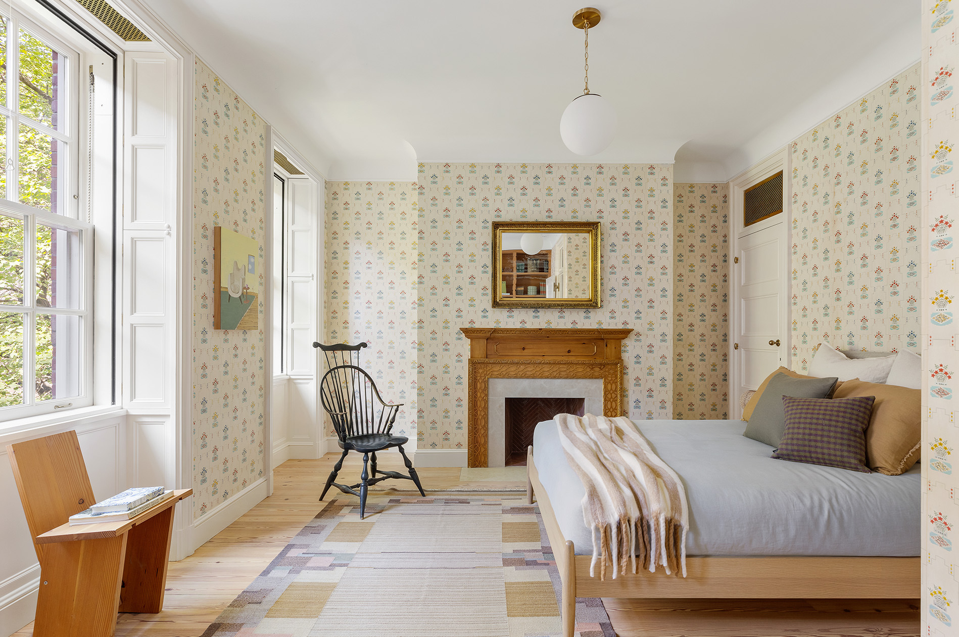 37 Harrison Street Manhattan, NY 10013 - Photo 15 of 26 a bedroom with a bed and a fireplace