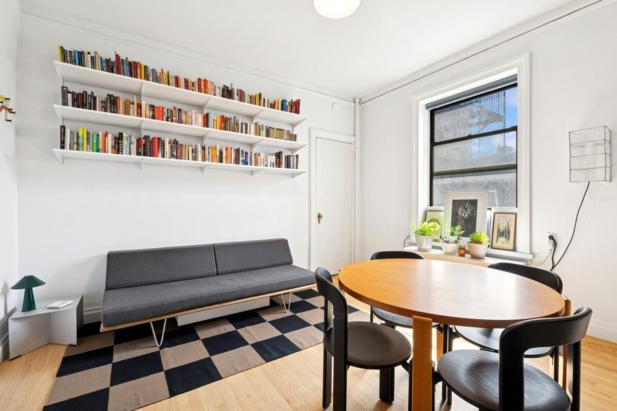 a workspace with furniture and window