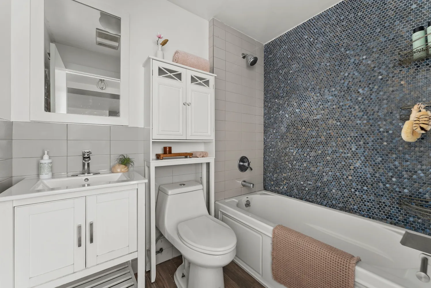 a spacious bedroom with a bed and a couch