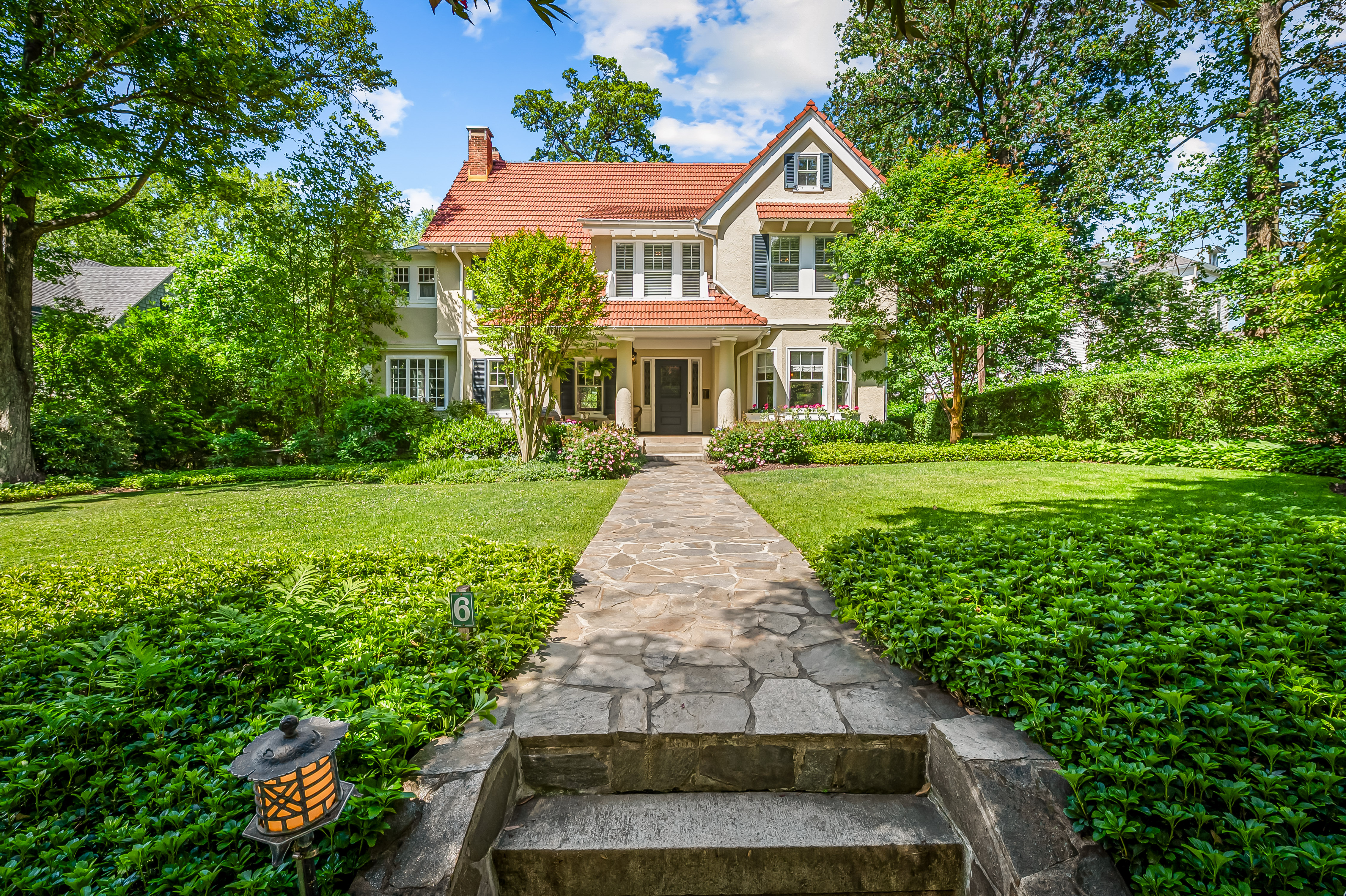 6 Elmhurst Road Baltimore, MD 21210 - Photo 1 of 100 a front view of a house with a yard and potted plants